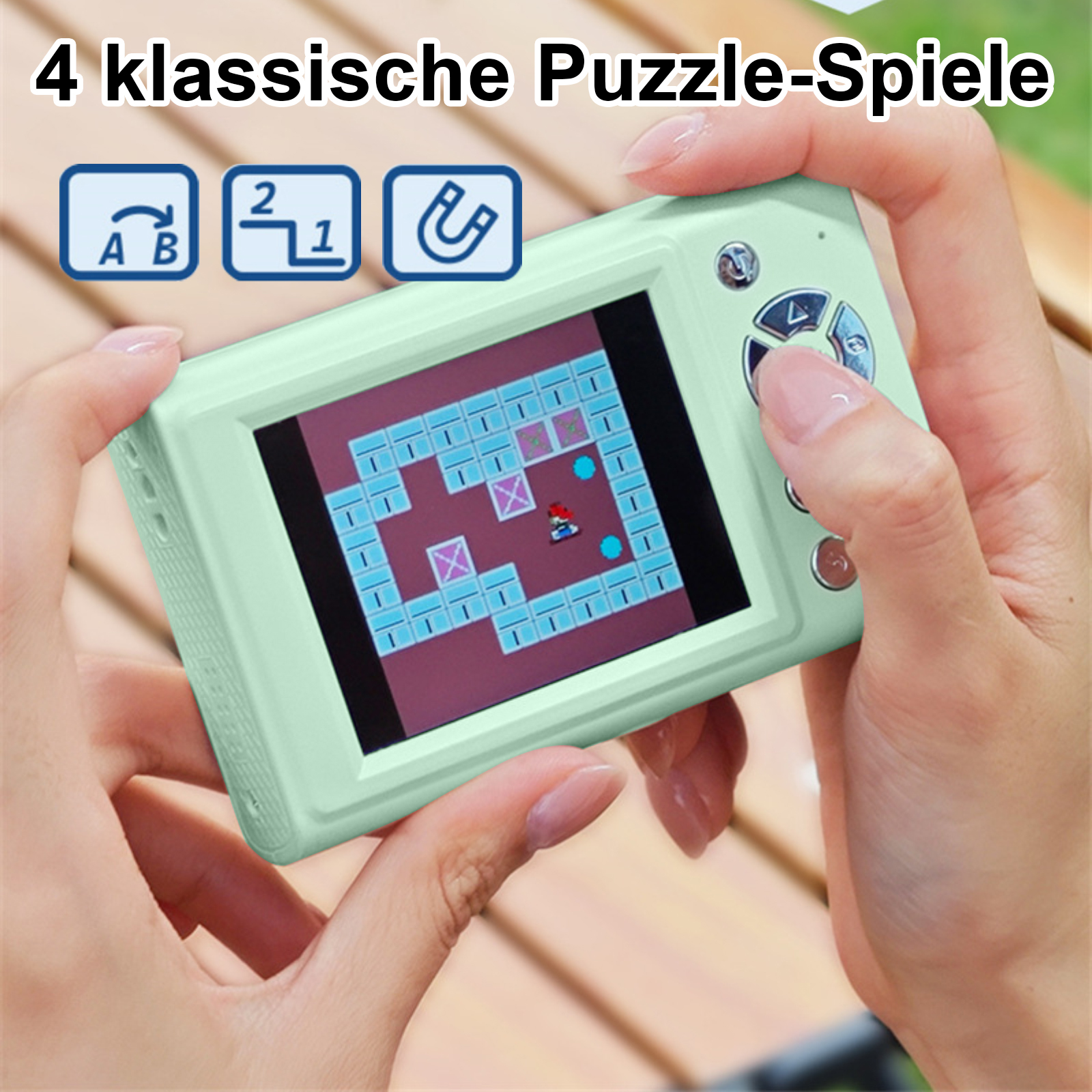 Eine Person hält eine mintgrüne Handheld-Spielkonsole und spielt ein Labyrinth-Spiel. Der Bildschirm zeigt einen roten Charakter.