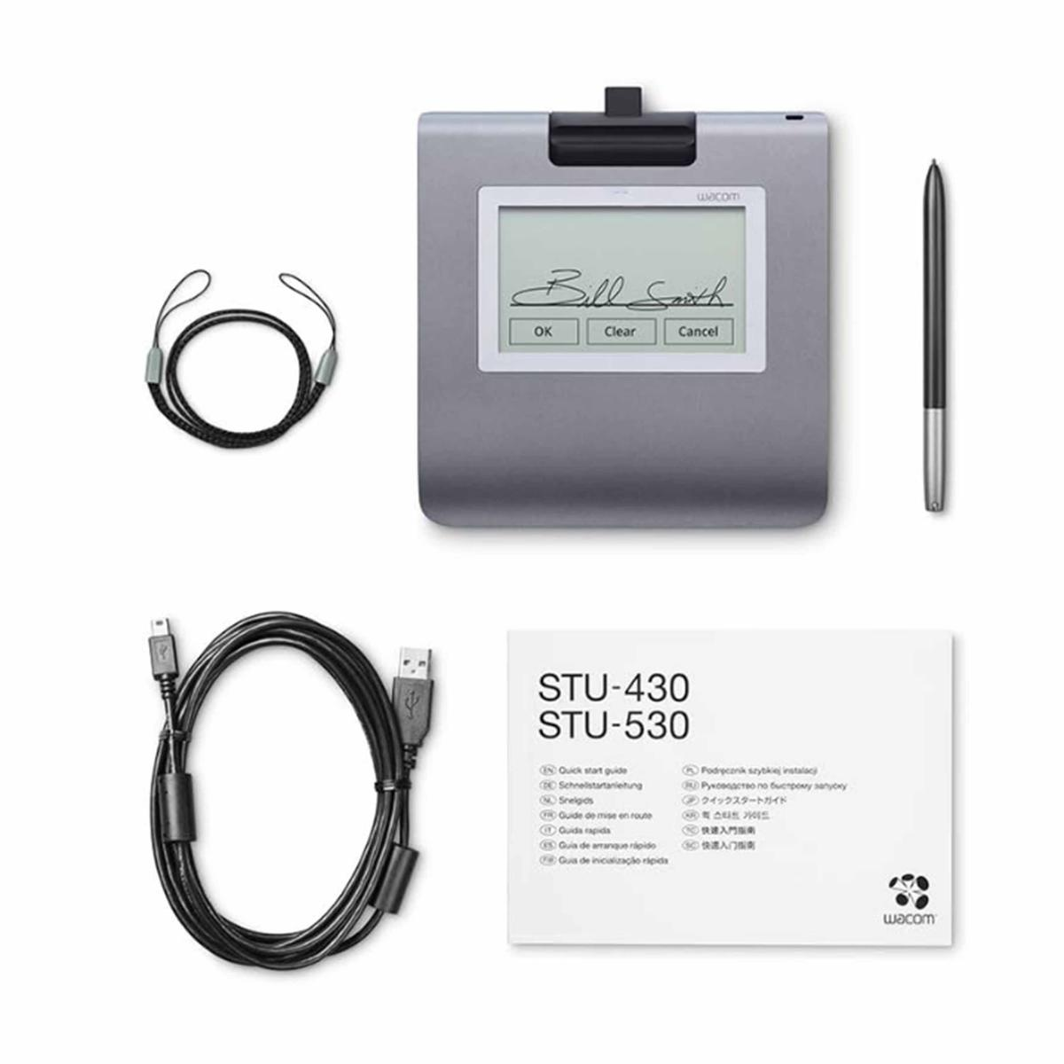 Wacom-Signaturpad mit Stift, Kabel und Dokumentation. Das Pad zeigt eine Unterschrift mit OK-, Clear- und Cancel-Tasten.