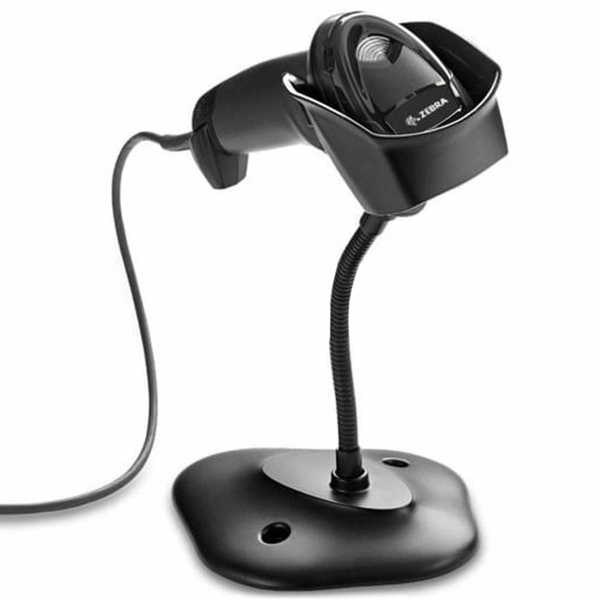 Uno scanner di codici a barre nero su un supporto. Lo scanner ha un collo flessibile e una base rotonda. Un cavo si estende dallo scanner.
