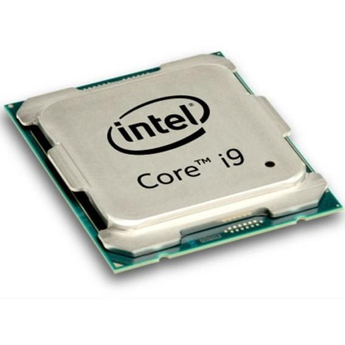 Procesor Intel Core i9. Ma srebrny wierzch z logo Intel i nadrukiem Core i9. Spoczywa na zielonej płytce drukowanej.