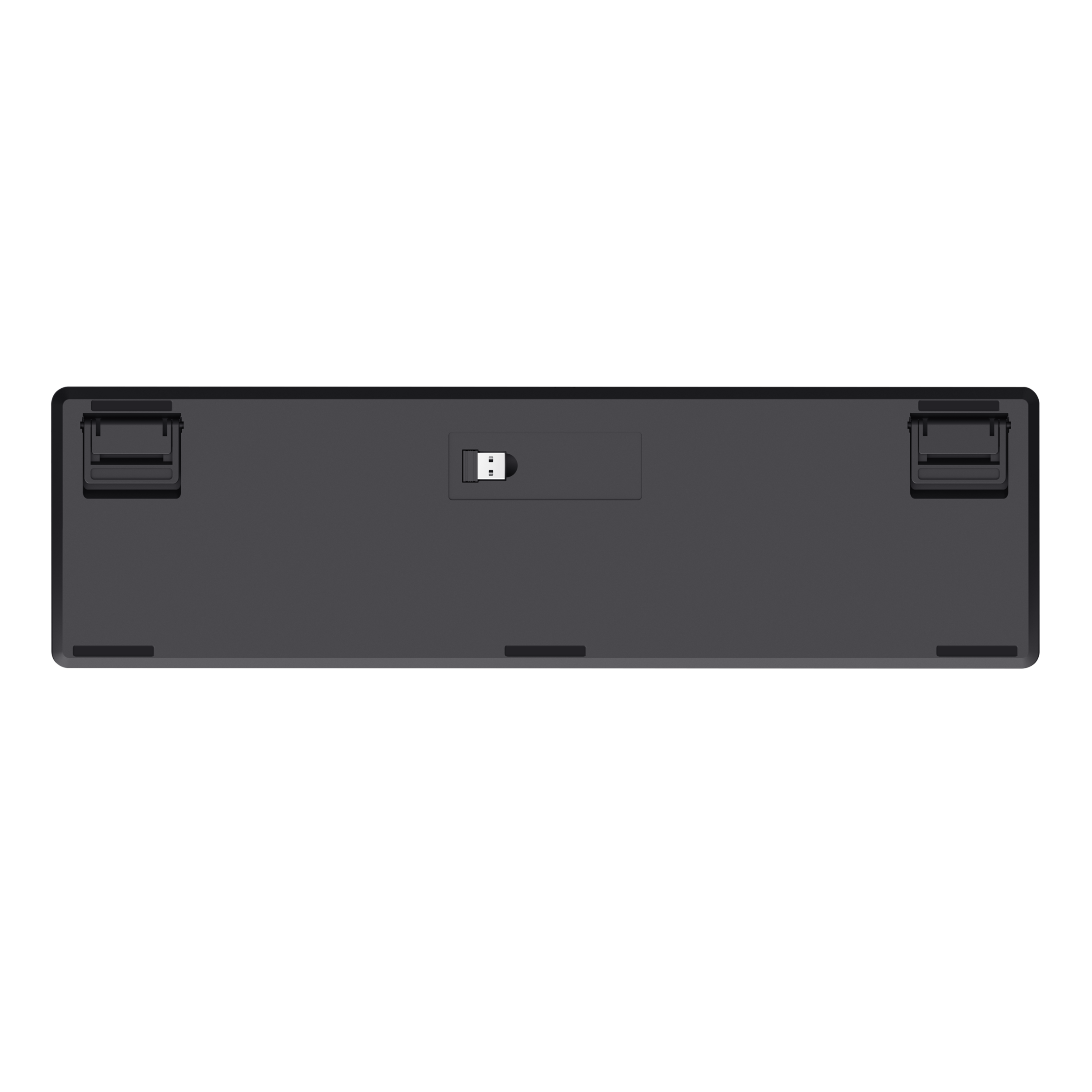 Unteransicht einer grauen Tastatur mit ausklappbaren Füßen und einem USB-Anschluss, vor schwarzem Hintergrund.