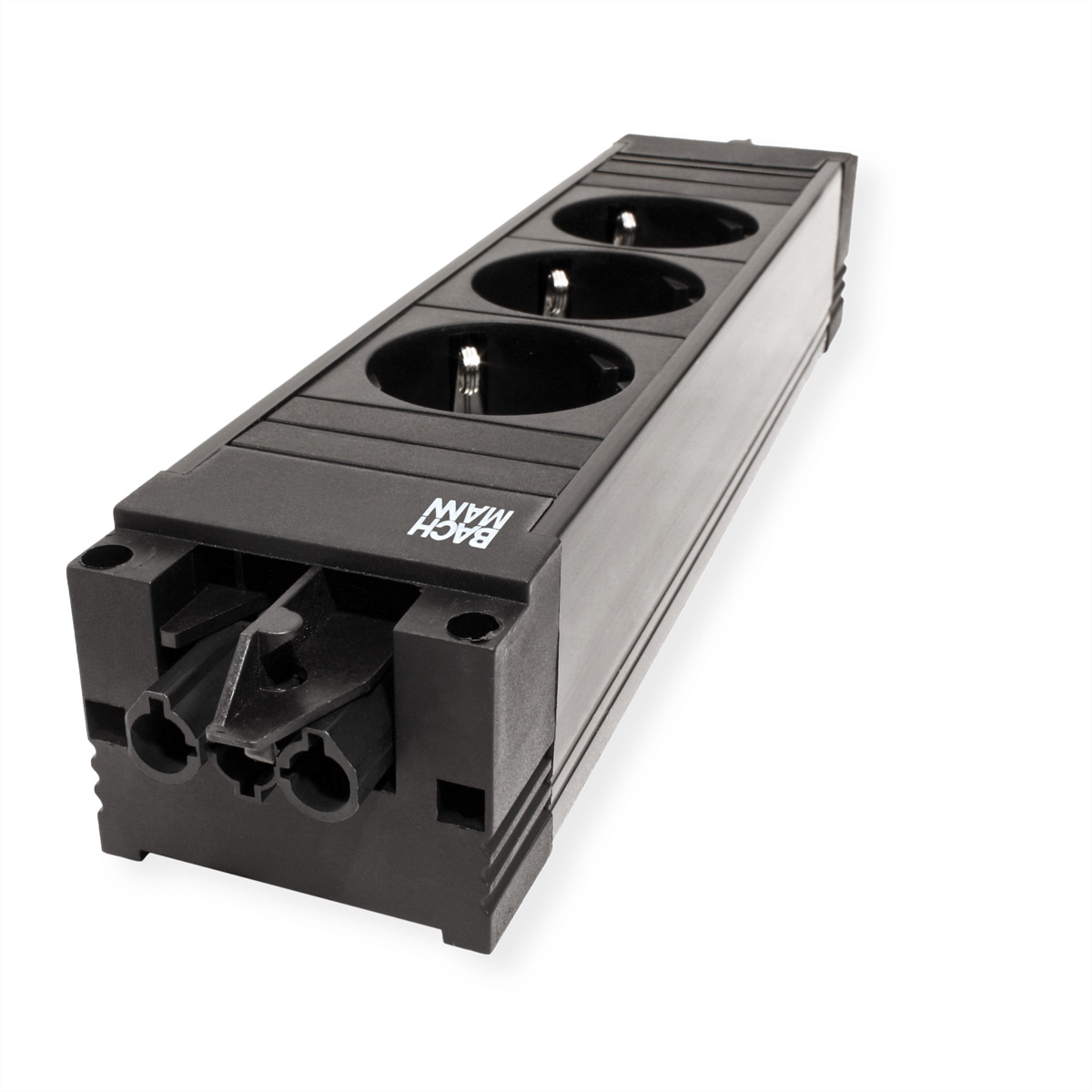 Czarna listwa zasilająca z trzema gniazdami na białej powierzchni. Widoczna marka "BACHMANN". Listwa zasilająca jest ustawiona pod kątem.