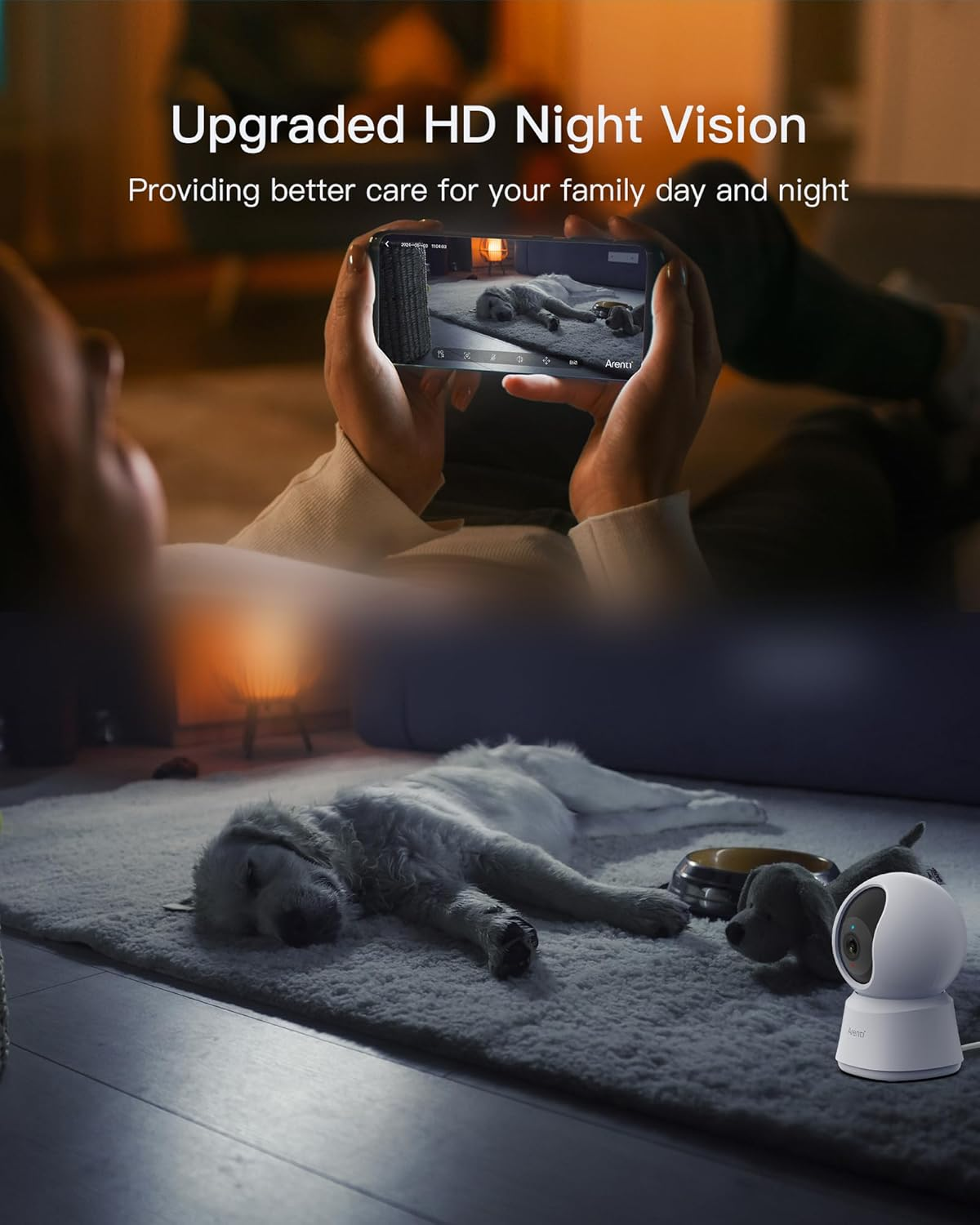 Eine Person hält ein Handy mit einem Hund auf einem Teppich. Ein weißer Hund, Spielzeug und eine Kamera liegen auf dem Teppich. Text: Verbesserte HD-Nachtsicht.