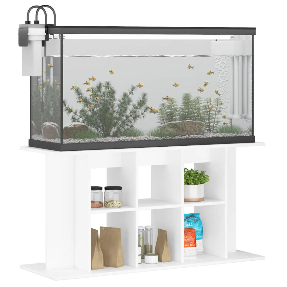 Ein Aquarium mit Fischen und Pflanzen steht auf einem weißen Schrank mit Regalen. Das Aquarium hat Fische, Pflanzen und Steine.
