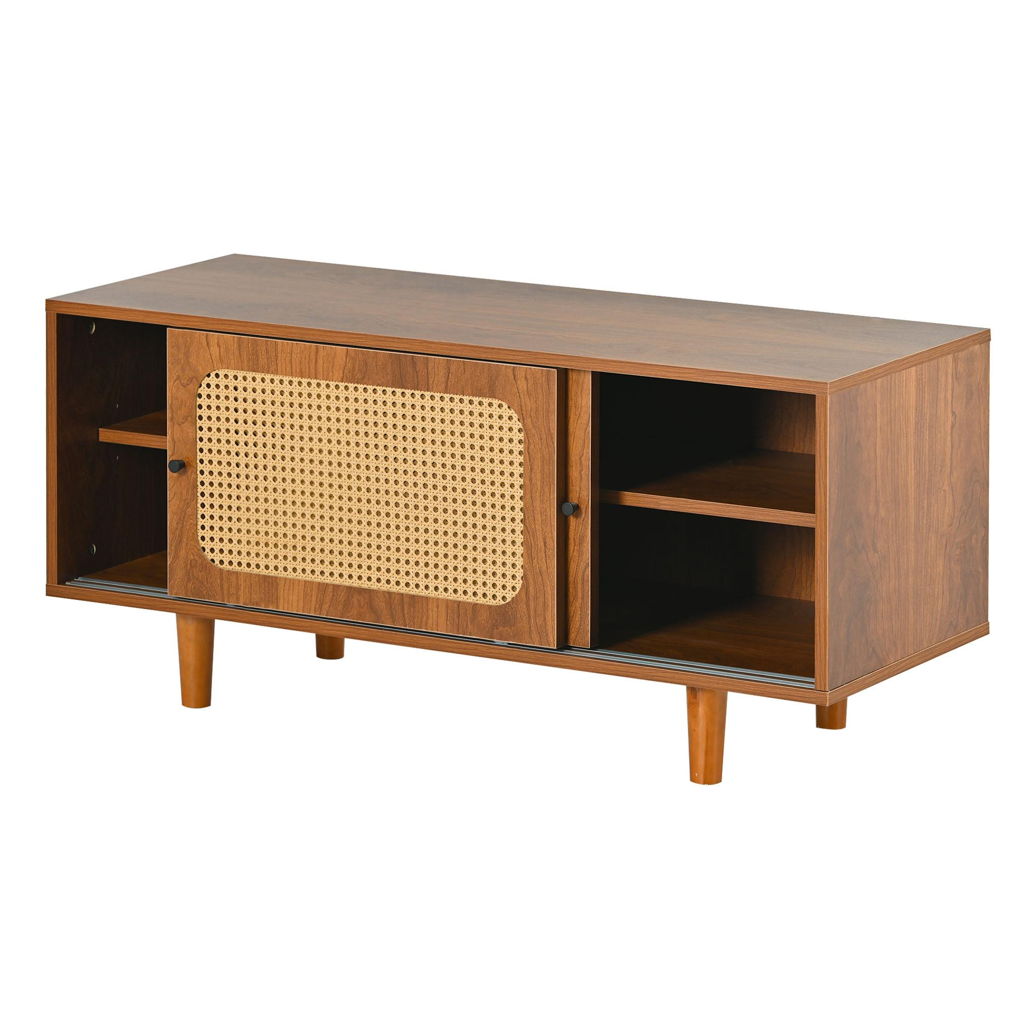 Ein Holzschrank mit einer gewebten Vordertür, Regalen und Holzbeinen. Der Schrank ist braun mit einer hellbraunen gewebten Tür.