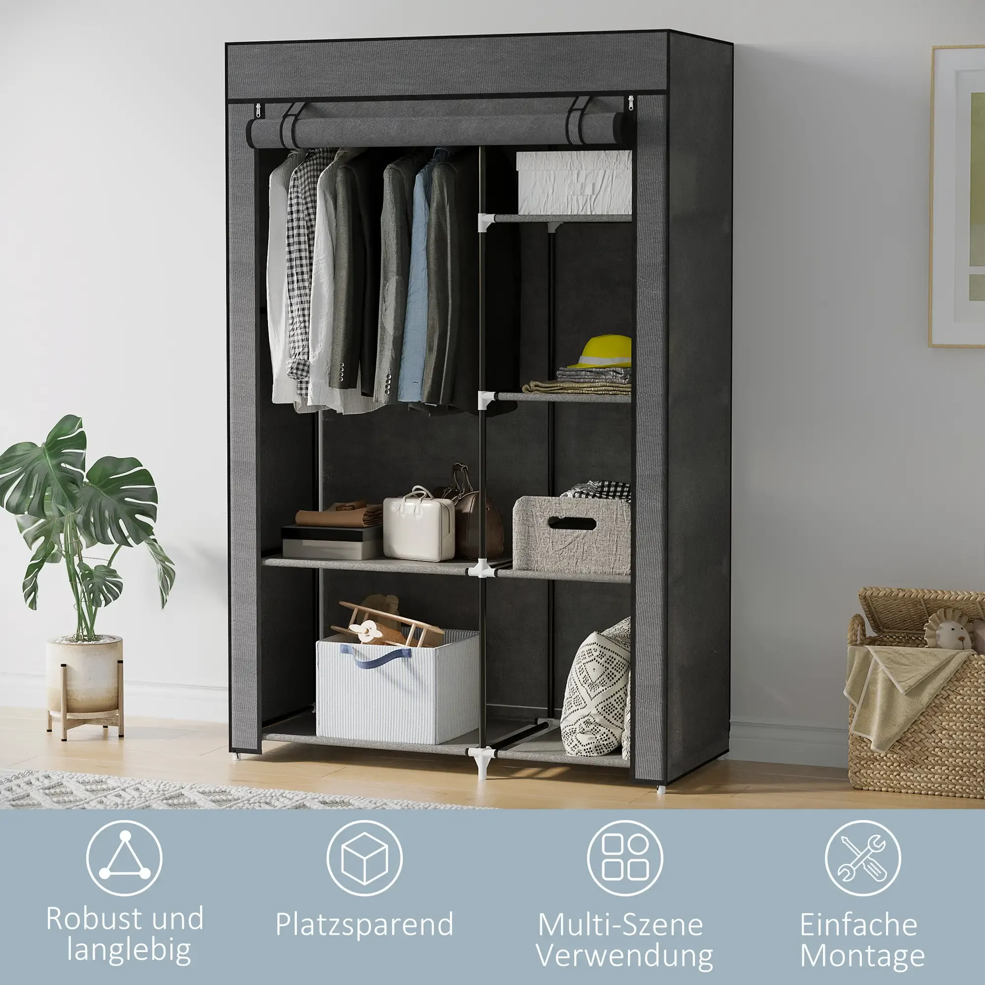 Ein dunkelgrauer tragbarer Kleiderschrank mit Kleidung, Boxen und Accessoires. Links und rechts sind eine Pflanze und ein Korb.