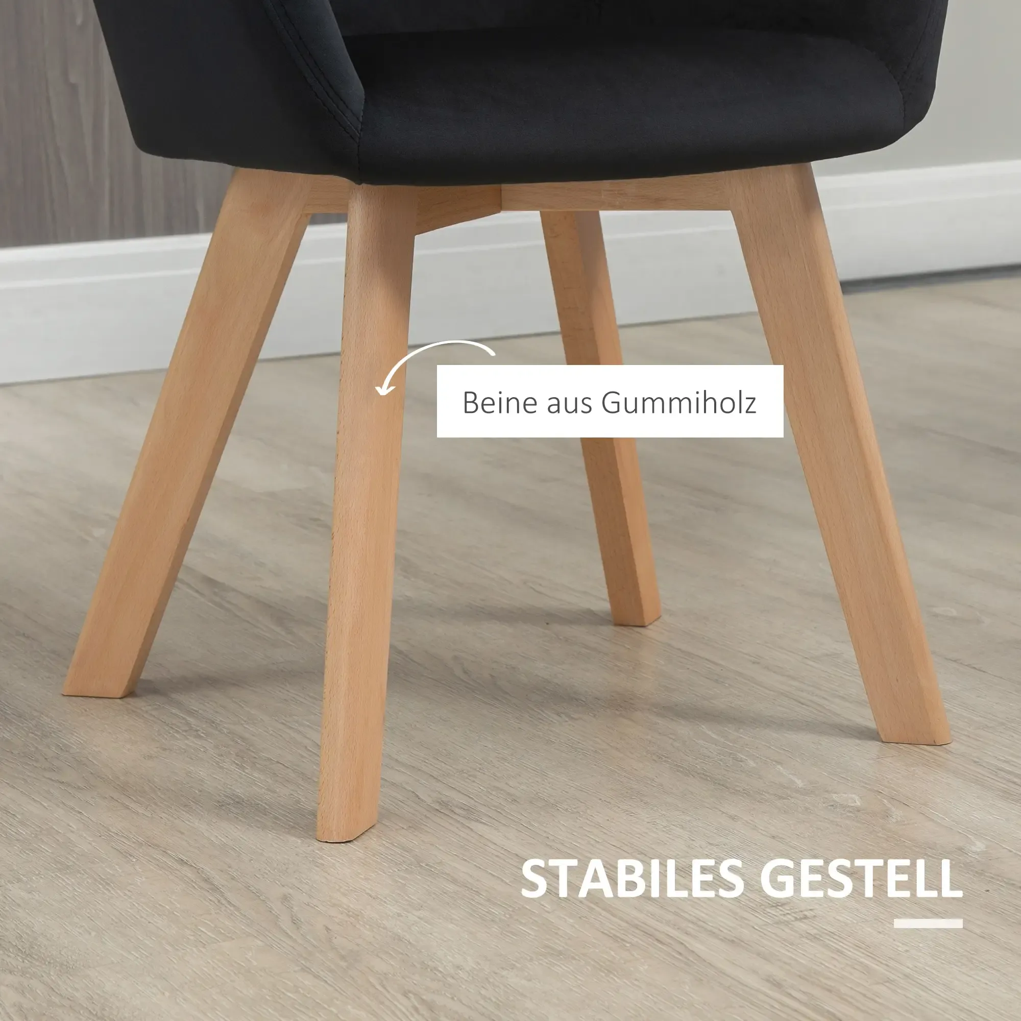 Stuhl mit Holzbeinen und schwarzem Sitz. Aufschrift: Beine aus Gummiholz und stabiles Gestell.