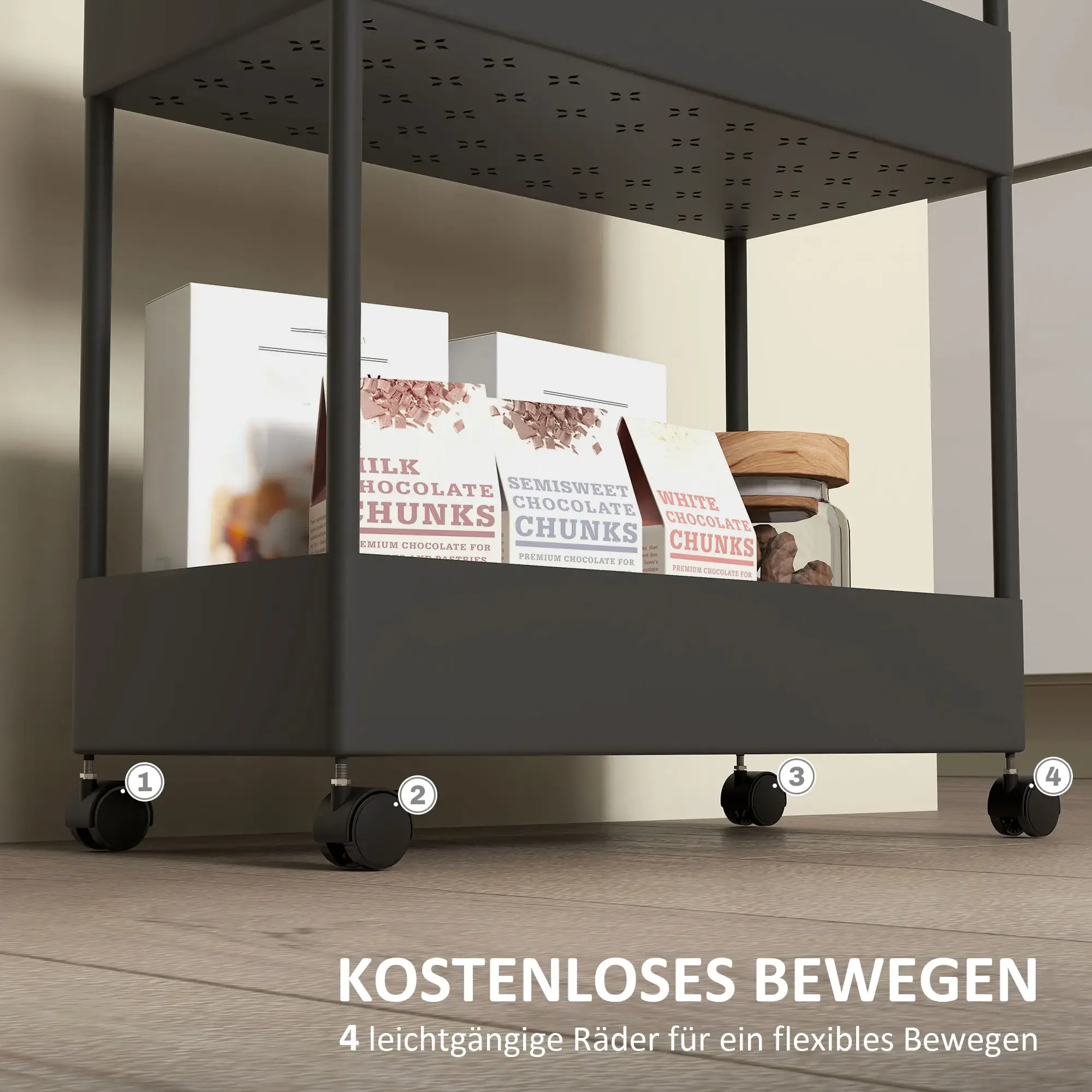 Ein schwarzer Rollwagen mit Regalen enthält Schokoladenstücke und ein Glas. Vier Räder auf dem Boden. Weißer Hintergrund.