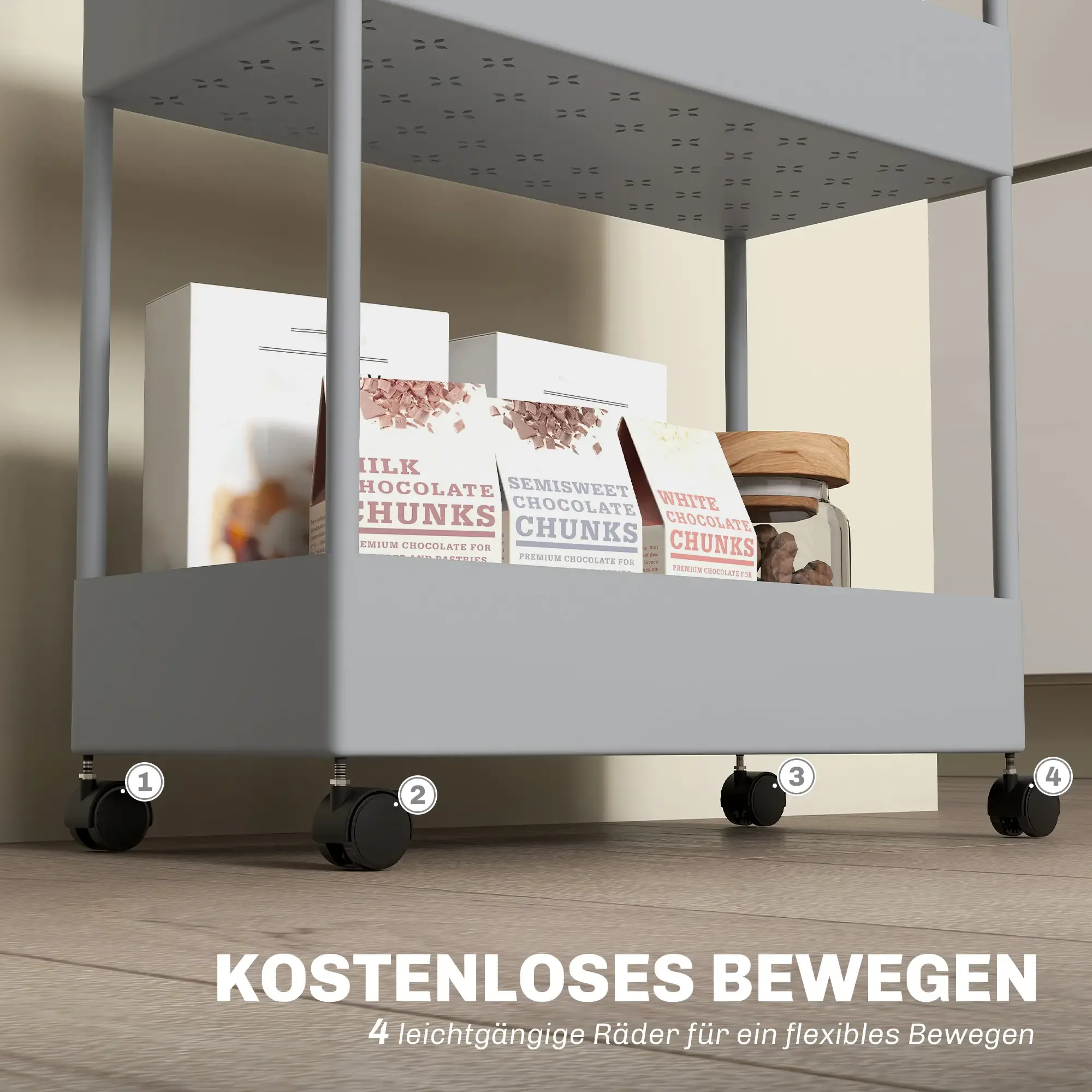Ein grauer Rollwagen mit Schokoladenboxen und einem Glas. Text lautet 'KOSTENLOSES BEWEGEN' und '4 leichtgängige Räder'.