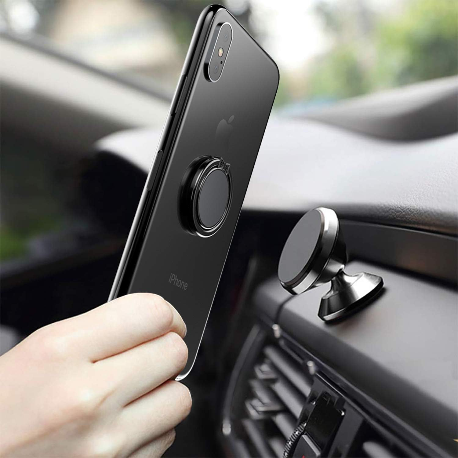 Eine Hand hält ein schwarzes iPhone mit einem Ringhalter. Eine Autohalterung befindet sich auf dem Armaturenbrett. Die Szene spielt sich in einem Auto ab.
