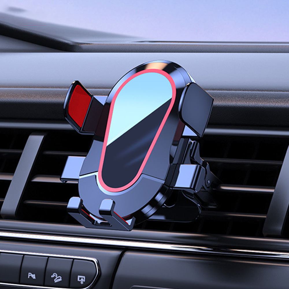 Ein schwarz-roter Autotelefonhalter ist am Luftauslass befestigt. Der Halter hat eine reflektierende Oberfläche und befindet sich in einem Fahrzeuginnenraum.