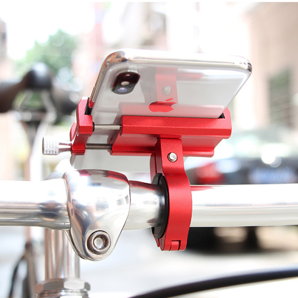 Ein roter Telefonhalter ist an einem Fahrradlenker befestigt. Ein klares Telefon mit Apple-Logo befindet sich im Halter. Der Hintergrund ist unscharf.