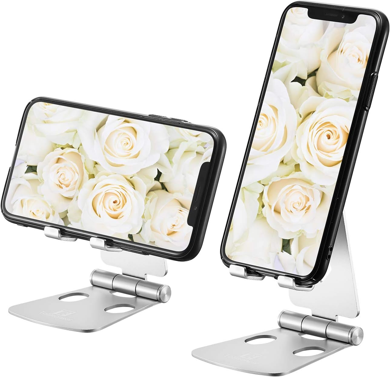 Zwei Smartphones mit weißen Rosen, montiert auf silbernen Ständern. Ständer haben ein faltbares Design. Telefone haben schwarze Ränder.