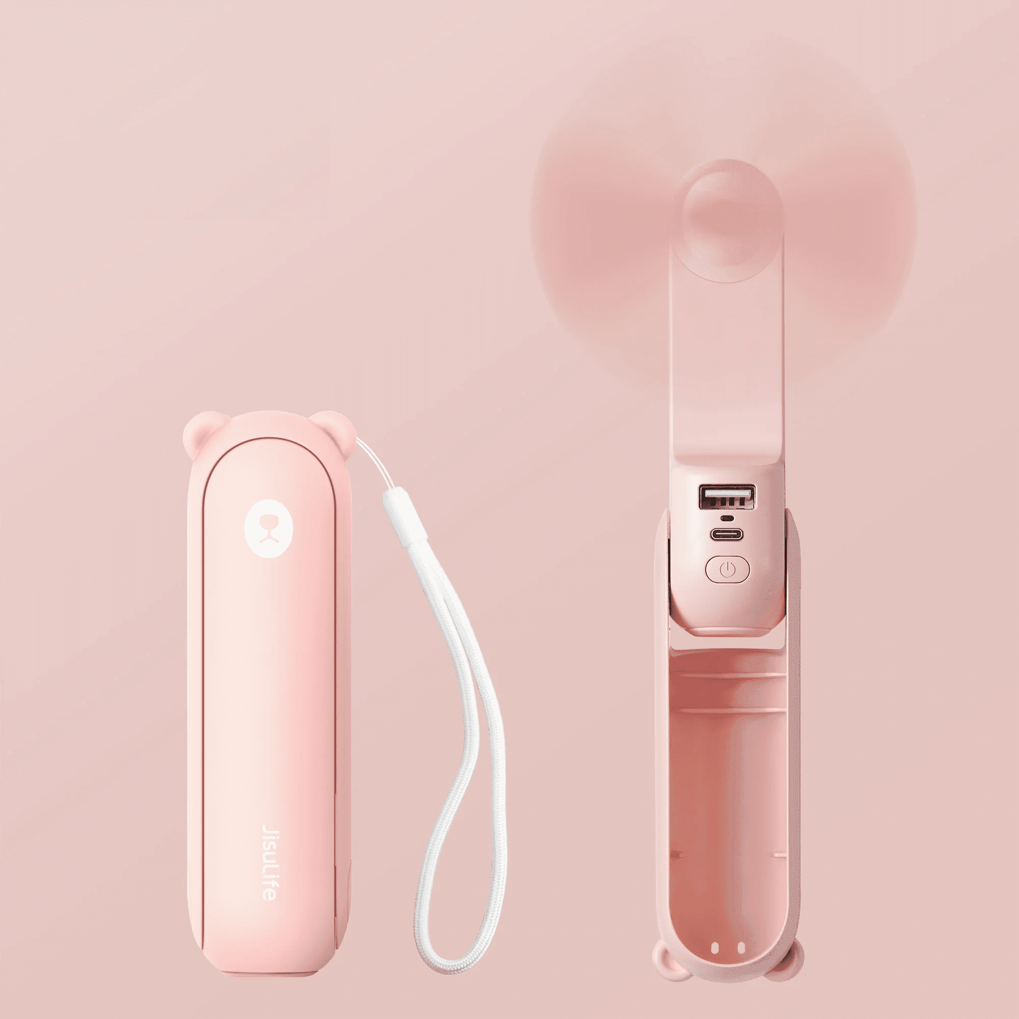 Rosa, bärenförmiger Handventilator mit geschlossenem Gehäuse und drehendem Ventilator. USB-Anschluss und Ein/Aus-Taste sichtbar.