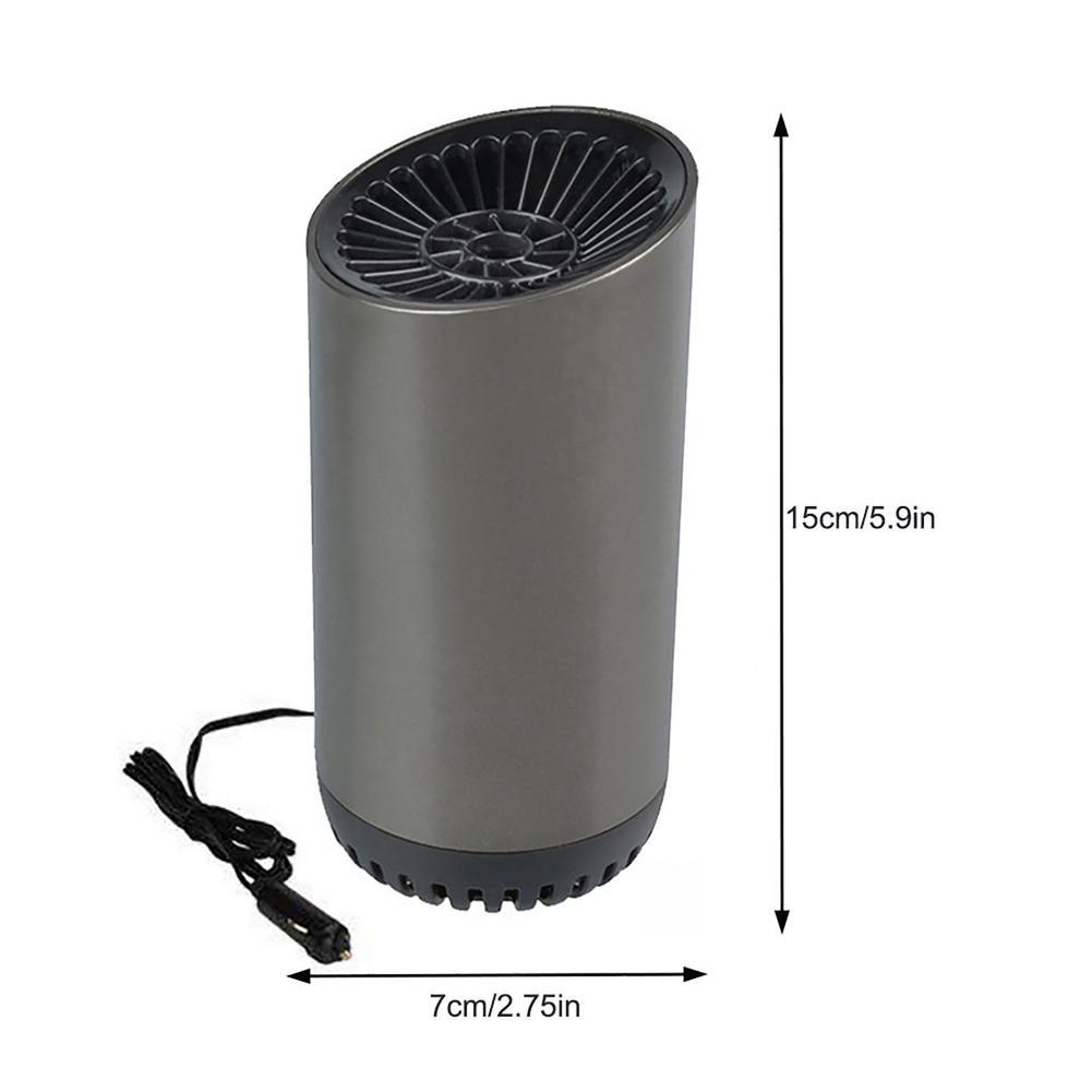 Ein grauer zylindrischer Ventilator mit einem schwarzen Netzkabel. Abmessungen: 15 cm hoch, 7 cm breit. Oberseite mit Grilldesign.
