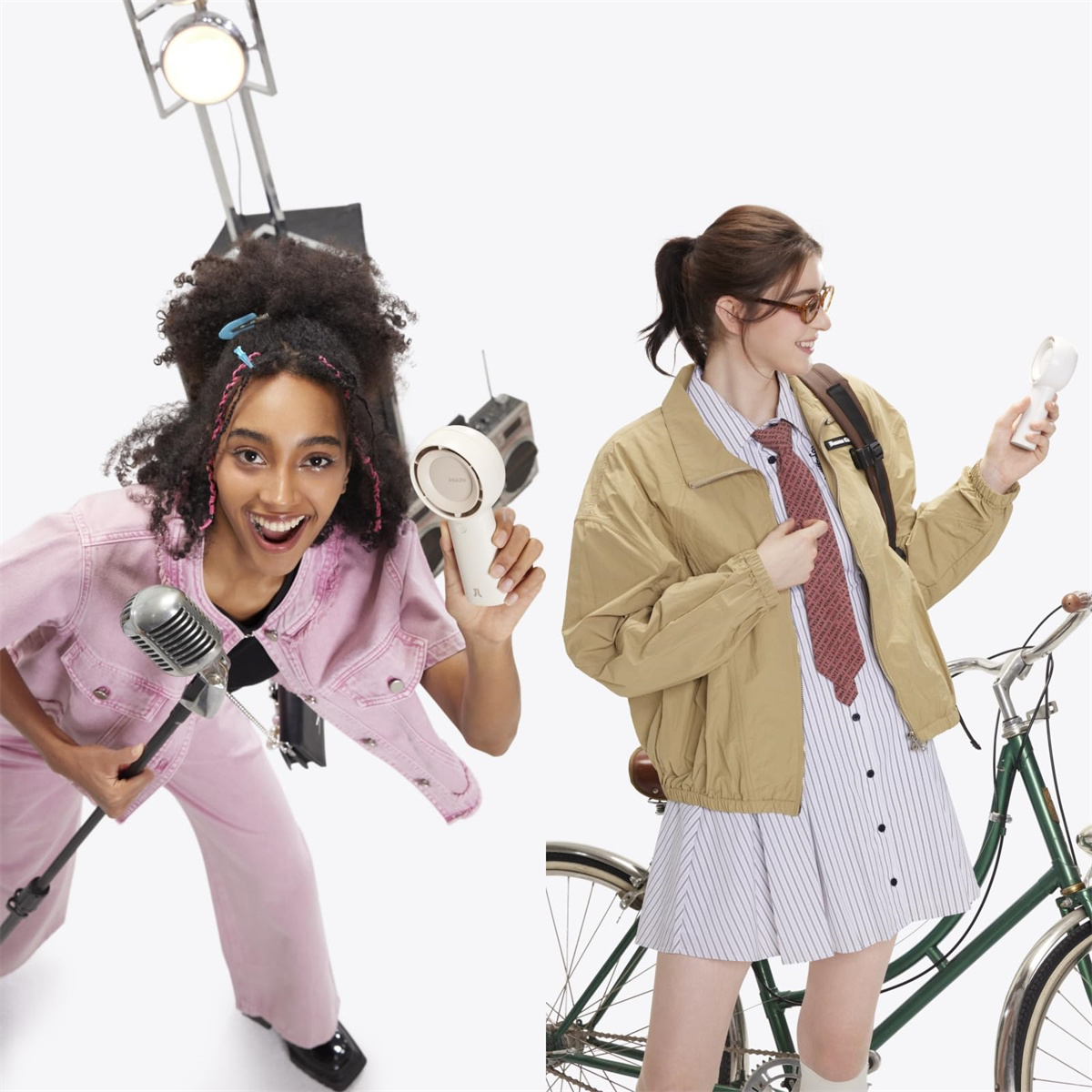 Zwei junge Frauen mit Ventilatoren. Eine hält ein Mikrofon, die andere ein Fahrrad. Beide lächeln.