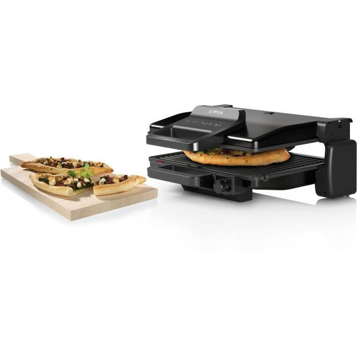 A black grill with a pizza inside and three small pizzas on a wooden board. White background.