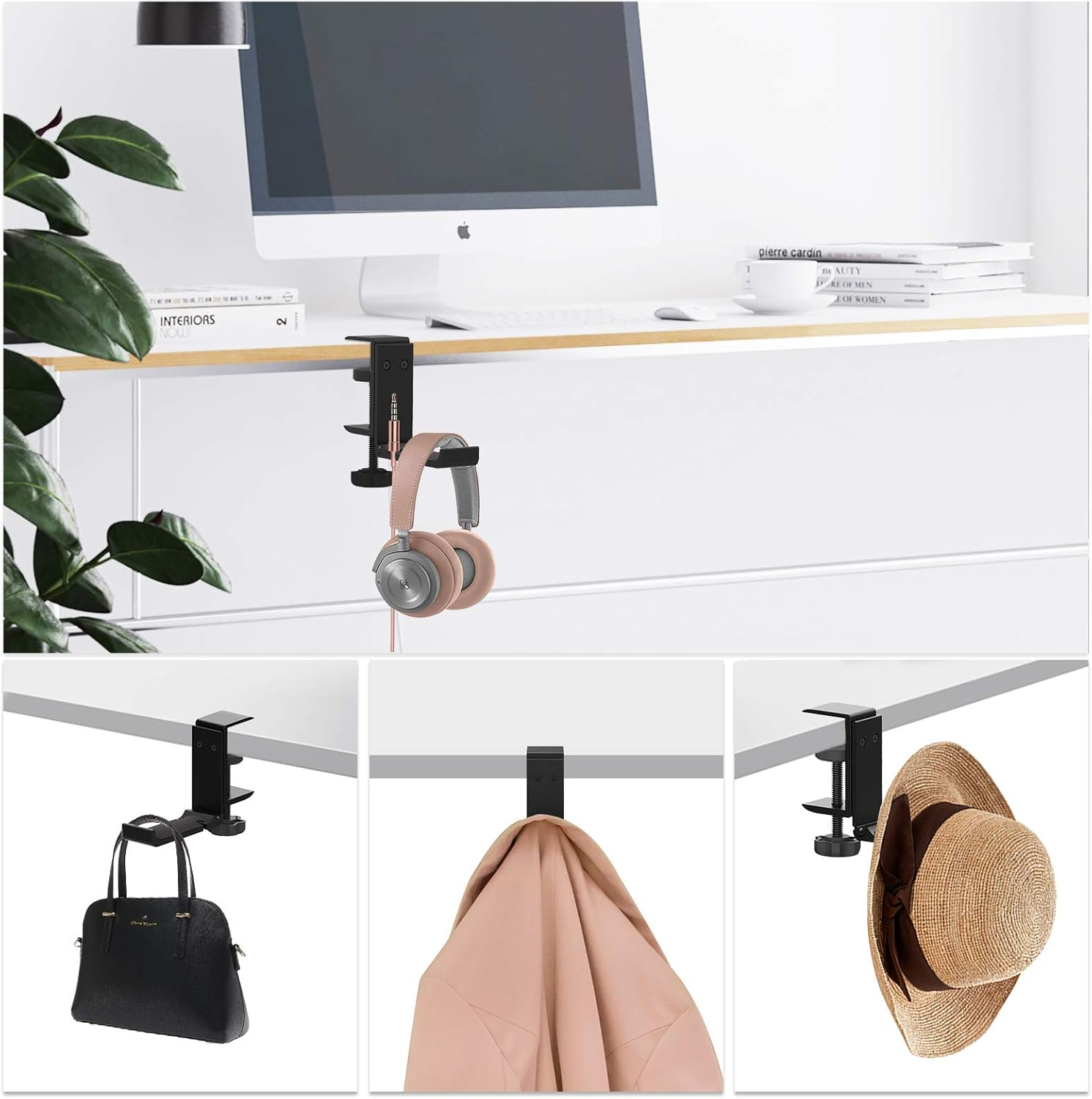 Ein Schreibtisch mit Monitor, Kopfhörern und Büchern. Eine schwarze Klemme hält die Kopfhörer. Eine Pflanze ist im Hintergrund.