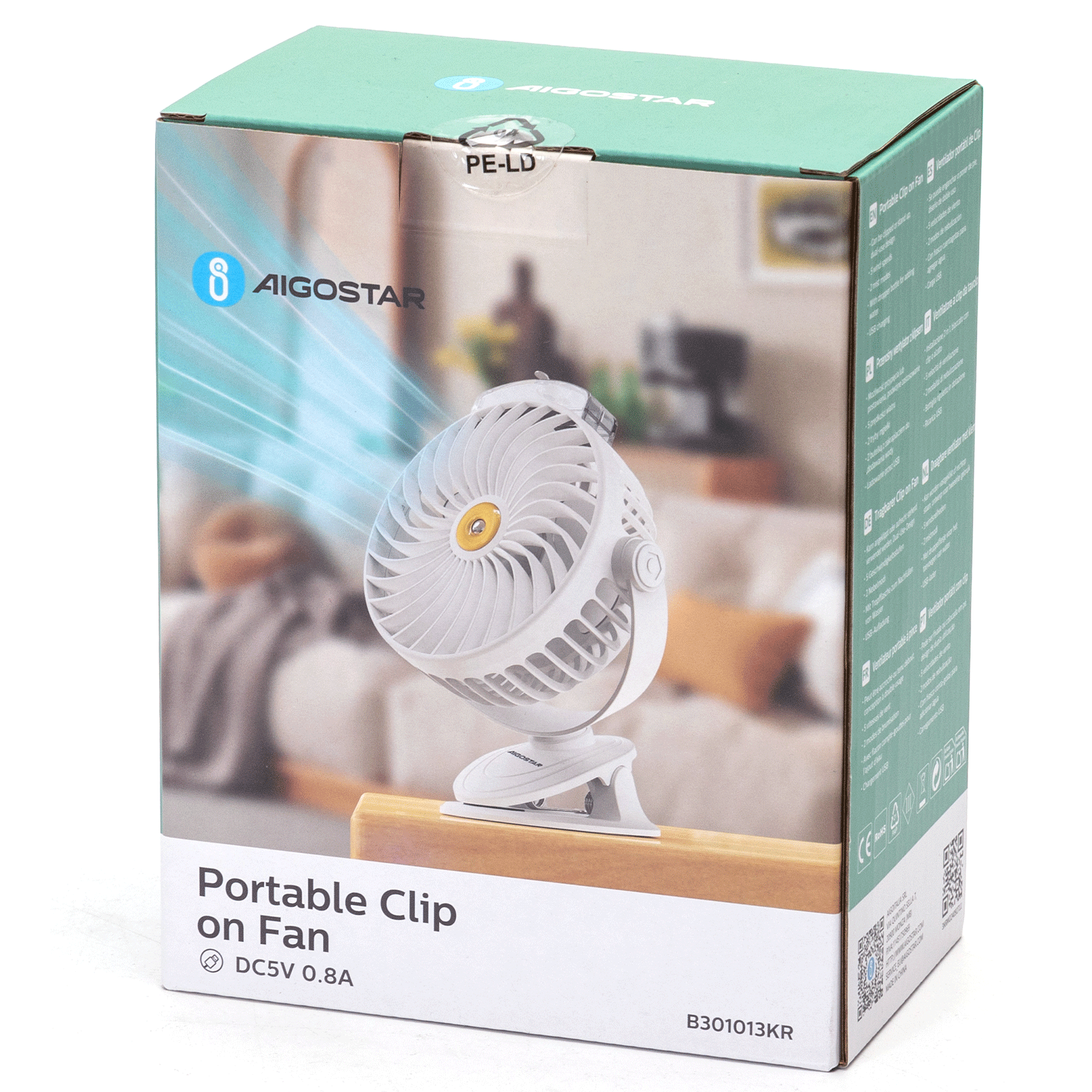 Ventilador de clip portátil blanco en caja. La caja muestra el ventilador, la marca Aigostar y detalles del producto.