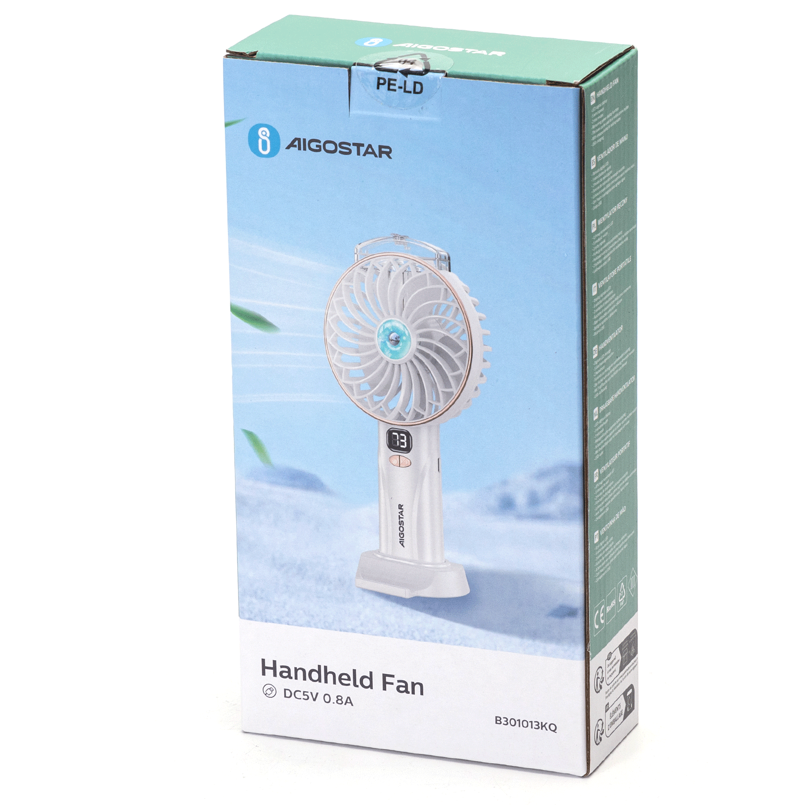 Ventilatore portatile bianco e oro nella sua scatola. La scatola ha testo in più lingue. Il ventilatore è bianco e ha un display digitale.