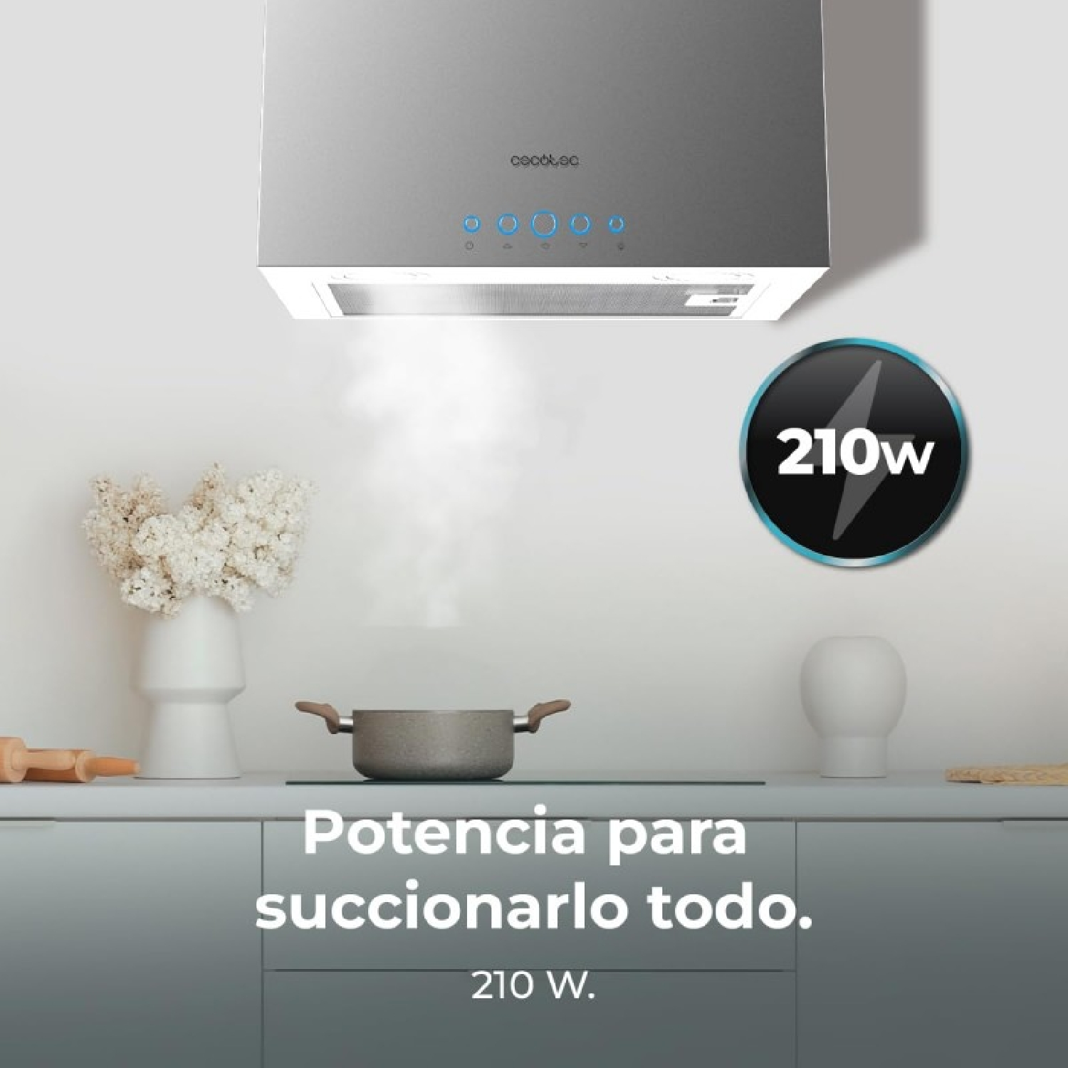 Escena de cocina con campana extractora plateada sobre una olla en una vitrocerámica. Gráfico de 210W.