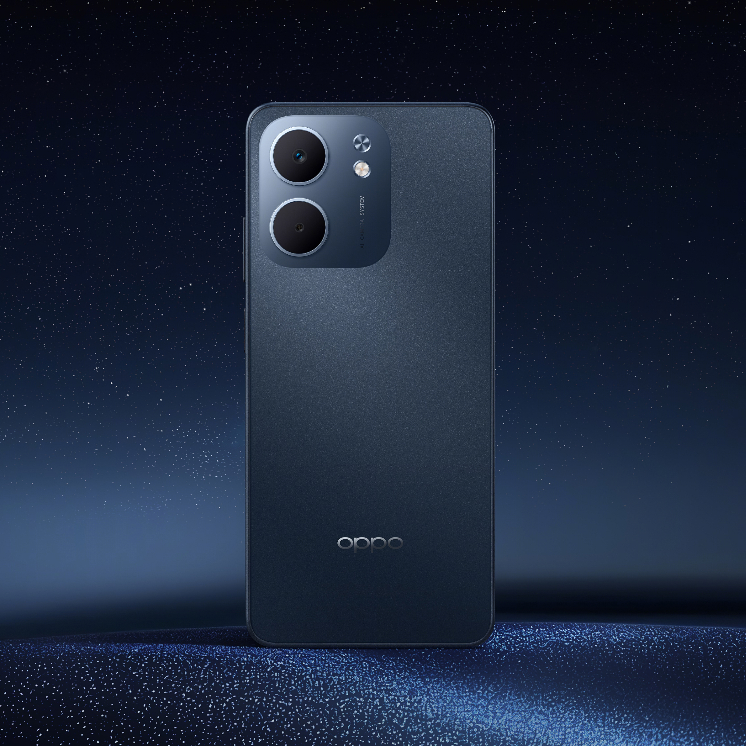 Ciemnoniebieski telefon z obiektywami aparatu jest wyśrodkowany. Tło to gwiezdna noc.