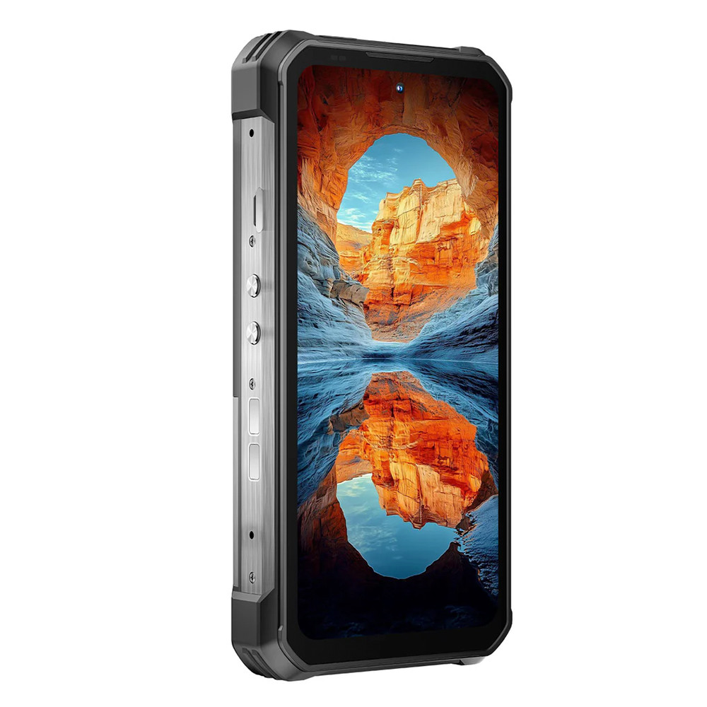 Uno smartphone robusto mostra una scena di canyon riflessa nell'acqua. Il telefono ha una cornice nera e pulsanti argentati.
