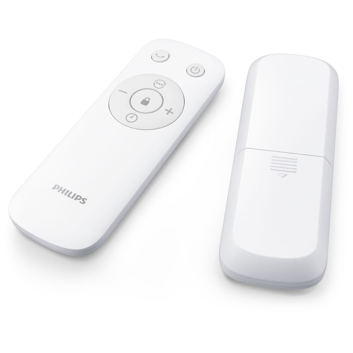 Dwa białe piloty Philips na białej powierzchni. Jeden ma przyciski i logo Philips. Drugi ma gładki, prostokątny kształt.