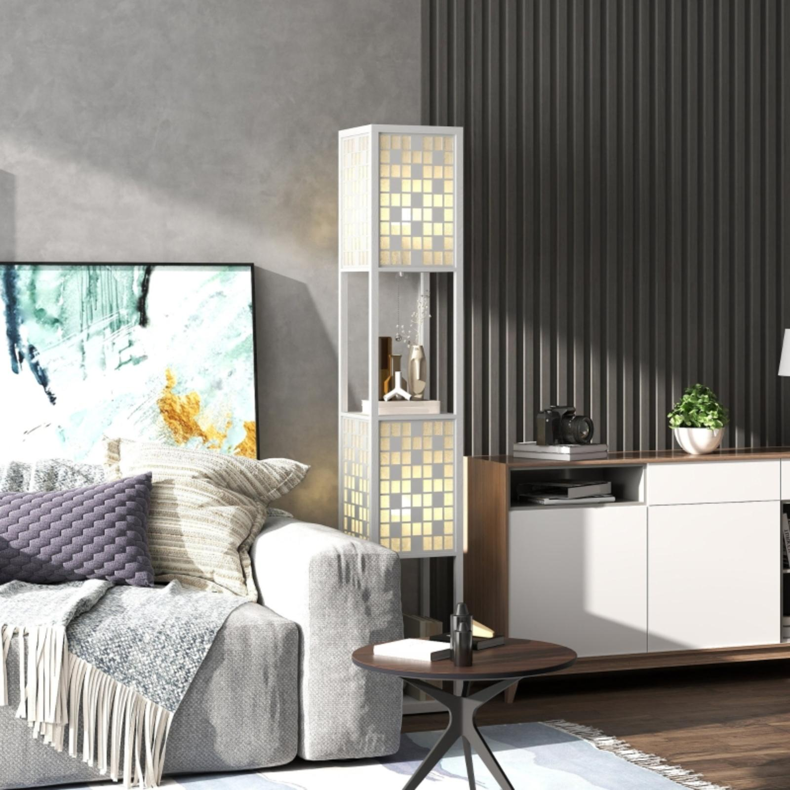 Wohnzimmer mit grauem Sofa, moderner Lampe, Kunstwerk und Couchtisch. Ein weißer Schrank und eine Pflanze in einem weißen Topf sind ebenfalls vorhanden.