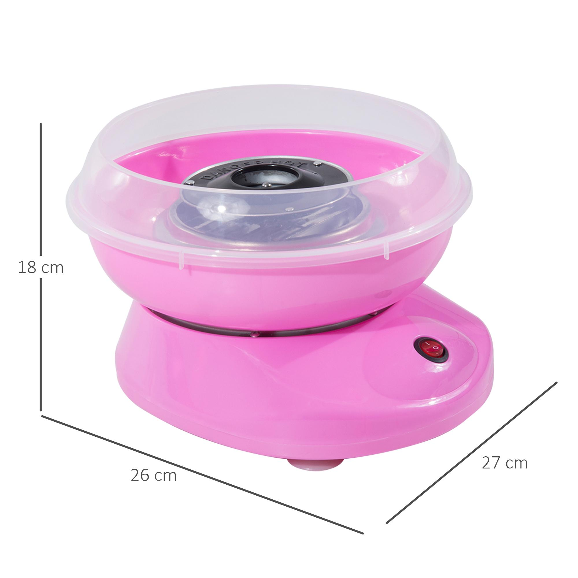 Eine rosa Zuckerwattemaschine mit einem klaren Deckel. Die Abmessungen sind mit 18 cm Höhe, 26 cm Breite und 27 cm Länge angegeben.