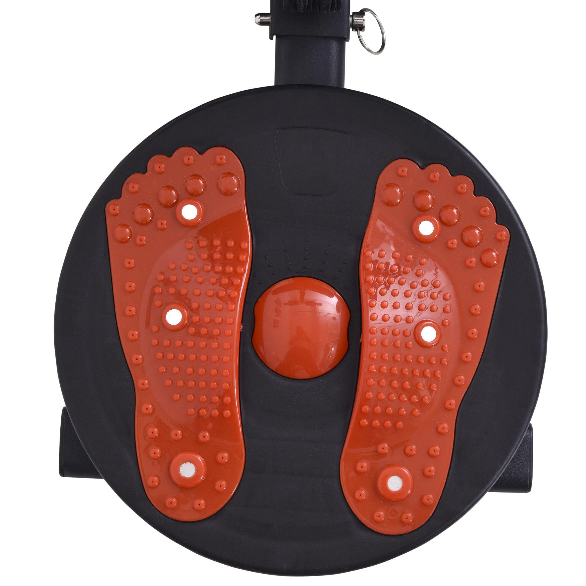 Schwarze und rote Trainingsmaschine. Sie hat zwei fußförmige Pads mit Noppen. In der Mitte befindet sich ein Knopf.