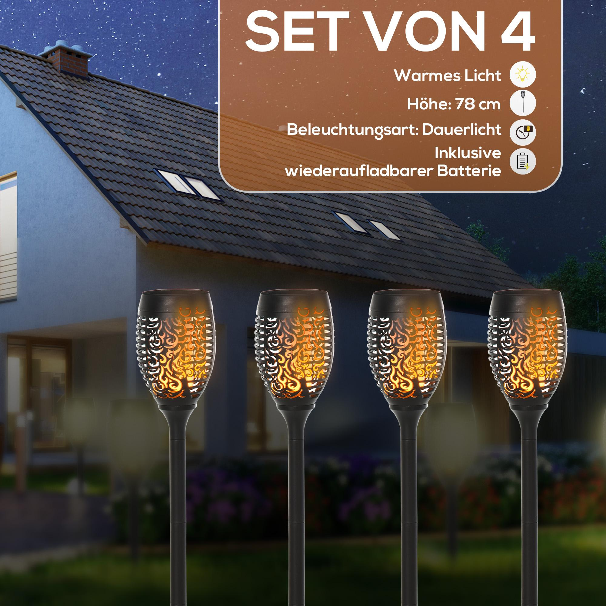 Vier Fackellichter mit Flammeneffekt stehen vor einem Haus bei Nacht. Oben steht 'Set von 4'.