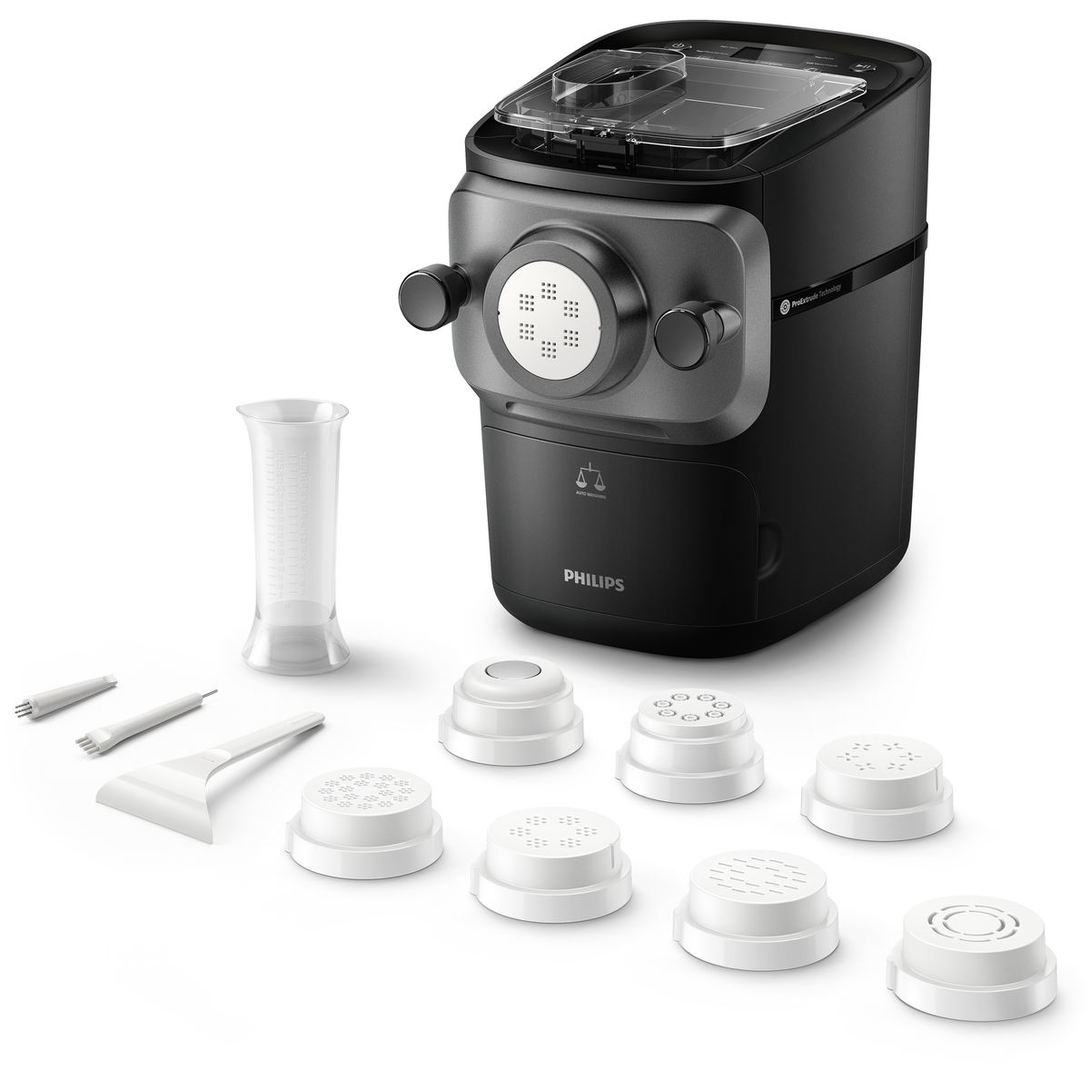 Maszyna do makaronu Philips z akcesoriami. Zawiera białe formy, miarkę i narzędzia do czyszczenia. Czarna i szara maszyna.