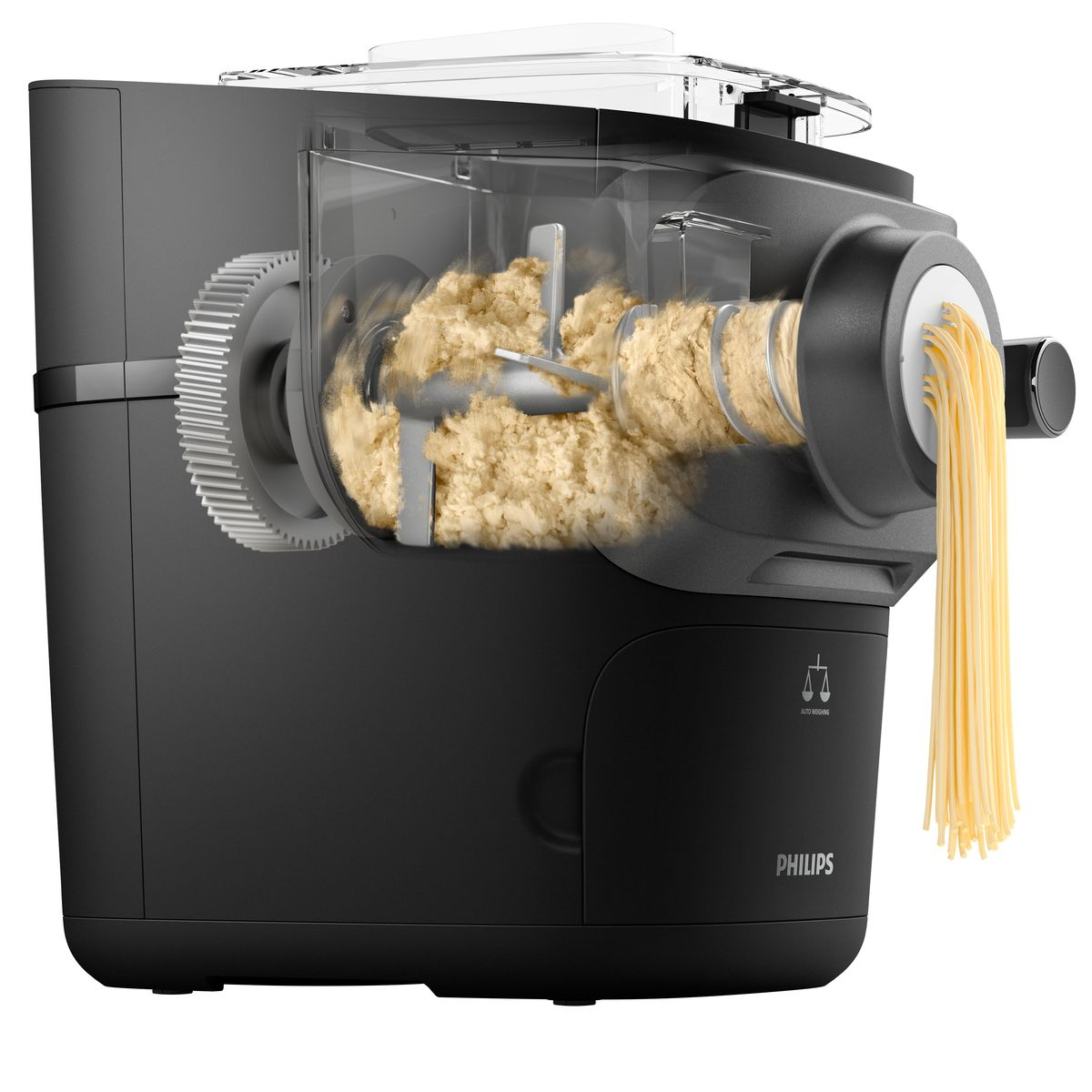 Czarna maszynka do makaronu Philips. W środku przetwarzane jest ciasto, ze spaghetti wychodzącym z dyszy. Widoczne jest koło zębate i logo automatycznego ważenia.
