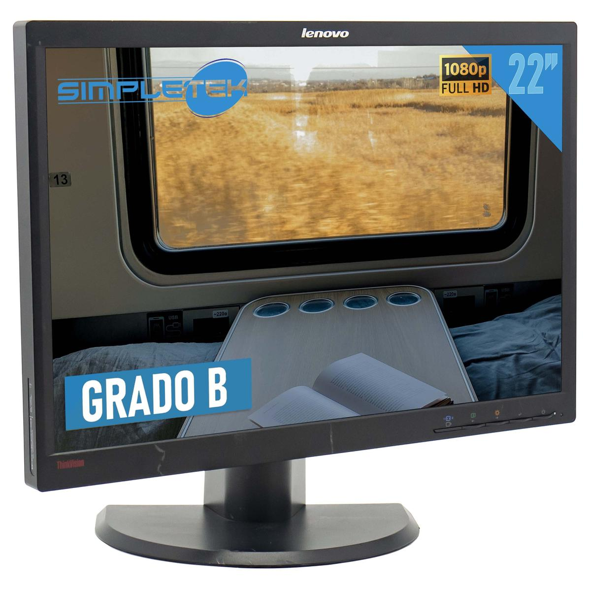 Il monitor Lenovo mostra l'interno di un treno con tavolo e libro. Lo schermo mostra un paesaggio con campi. Un'etichetta blu dice 'Grado B'.