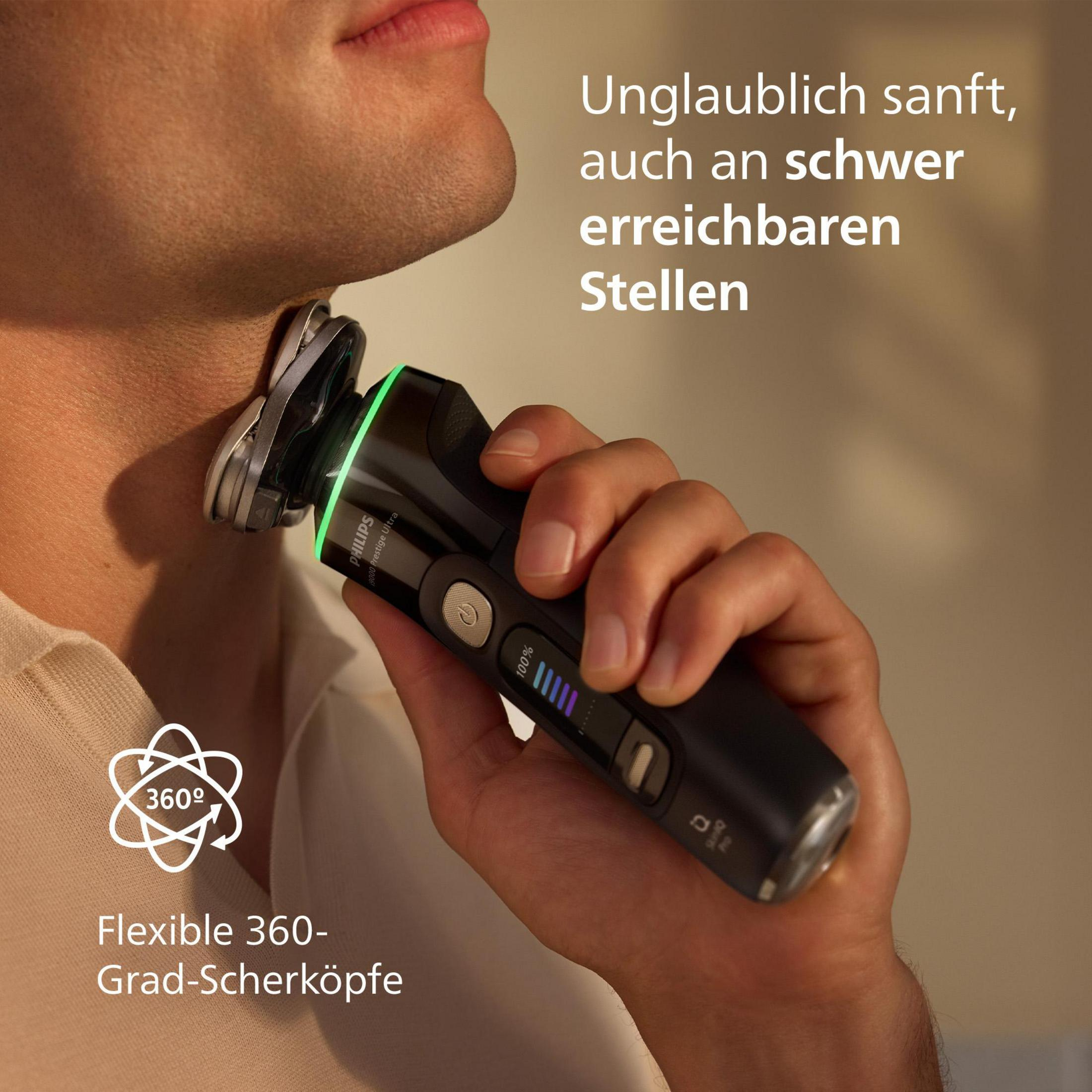 Osoba goli szyję golarką elektryczną. Golarka jest czarna i srebrna. Ręka trzyma golarkę.