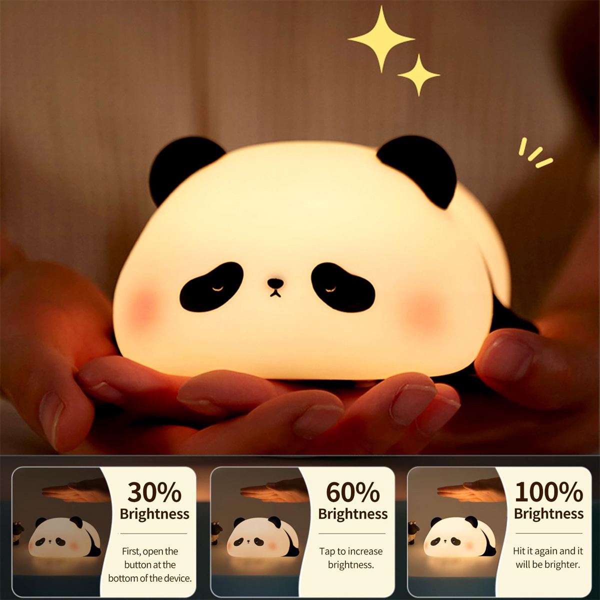 Ein leuchtendes, panda-förmiges Nachtlicht wird in zwei Händen gehalten. Es hat ein schwarz-weißes Design mit einem süßen Gesicht.