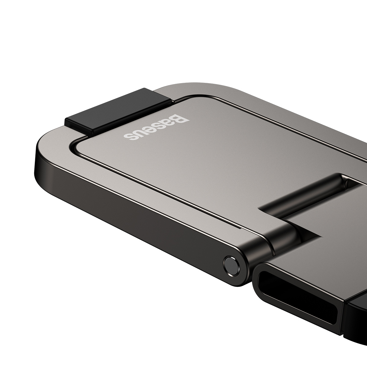 Metaliczny szary stojak na telefon Baseus jest ustawiony pod kątem. Ma czarny zawias i czarny prostokąt na górze. Tło jest białe.