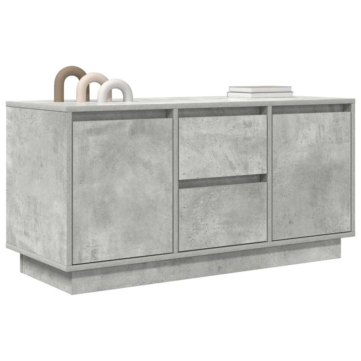 Eine graue Beton-Sideboard mit heller Oberseite. Es hat zwei Türen und zwei Schubladen. Oben befinden sich drei Bögen und zwei Bücher.