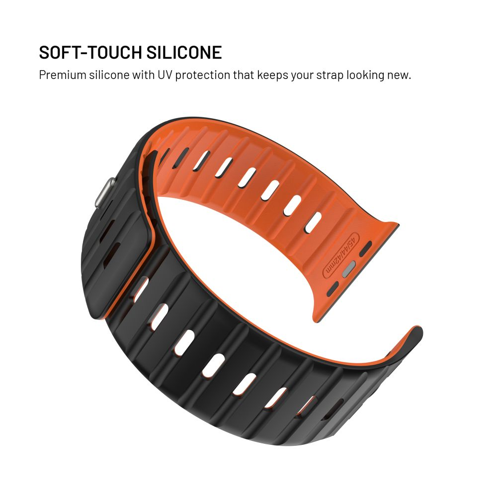 Ein orangefarbenes und schwarzes Armband. Das Armband besteht aus Silikon mit Aussparungen. Der Text lautet "SOFT-TOUCH SILICONE".