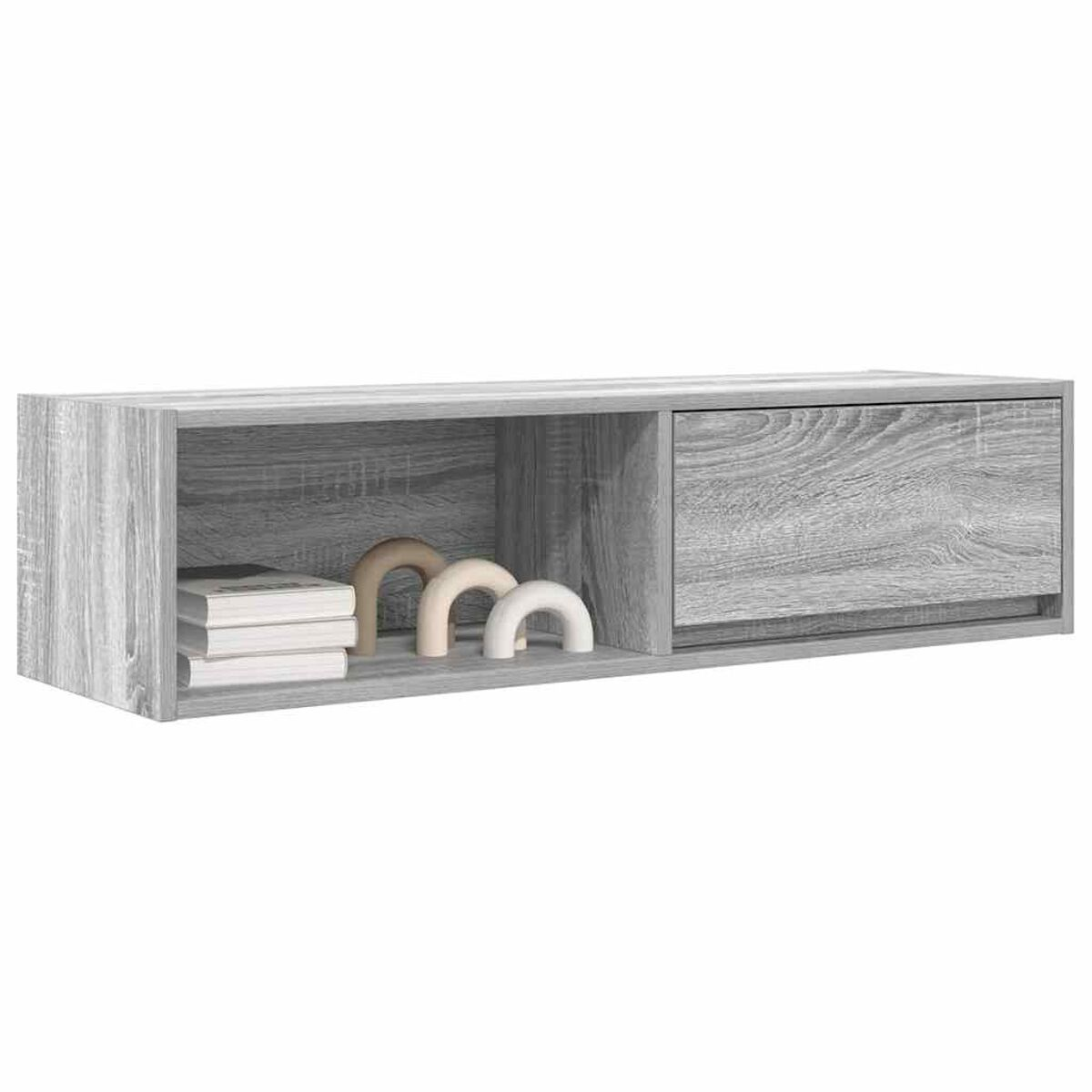 Ein graues, schwebendes Holzregal mit offenem Fach für Bücher und Bögen sowie einem geschlossenen Fach mit Schublade.