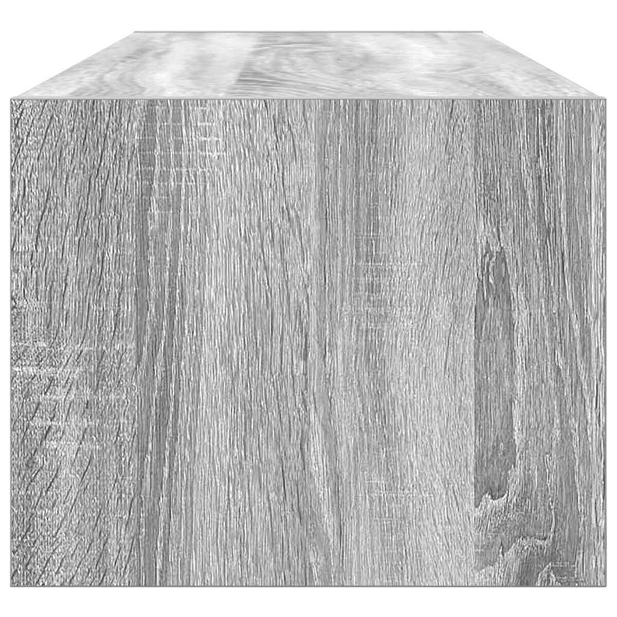 Nahaufnahme eines grauen Holzquaders. Die Holzmaserung ist sichtbar. Die Ober- und Seitenflächen sind hellgrau.