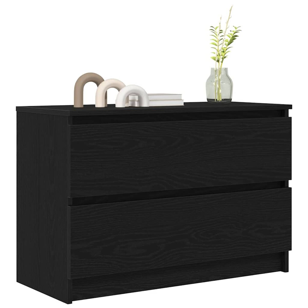 Eine schwarze Holzkommode mit zwei Schubladen. Oben befinden sich dekorative Bögen, Bücher und eine Vase mit Pflanzen.