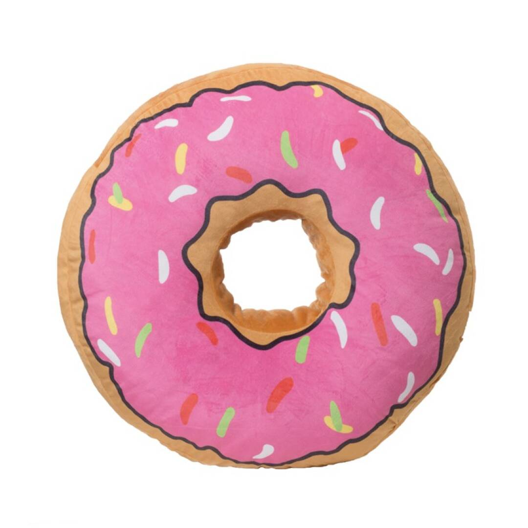 Ein rosa Kissen in Donutform mit Streuseln. Es hat eine hellbraune Mitte und eine rosa Glasur. Der Hintergrund ist weiß.