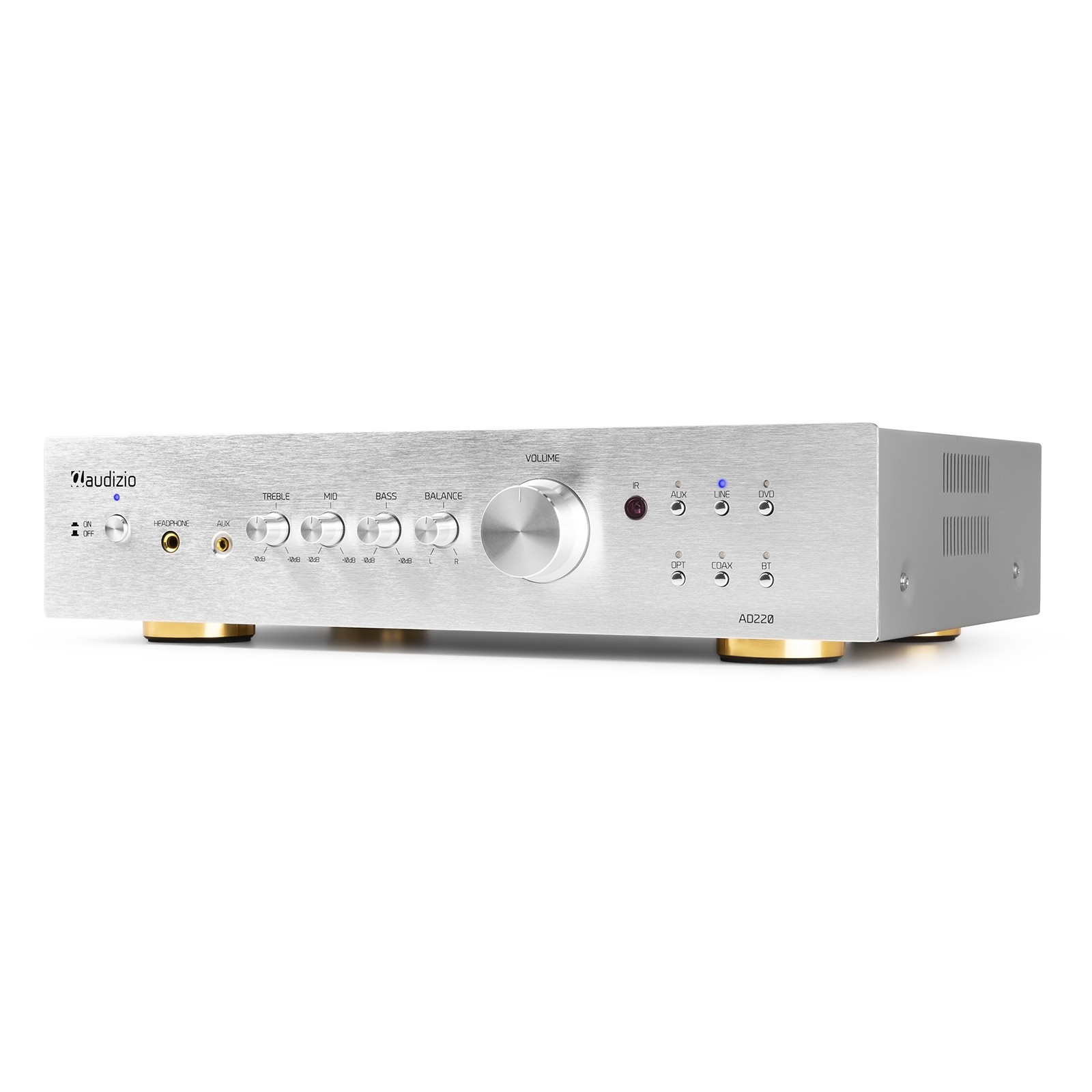 Amplificador de audio plateado con perillas y botones. Tiene patas doradas. Muestra controles de volumen, agudos y graves.