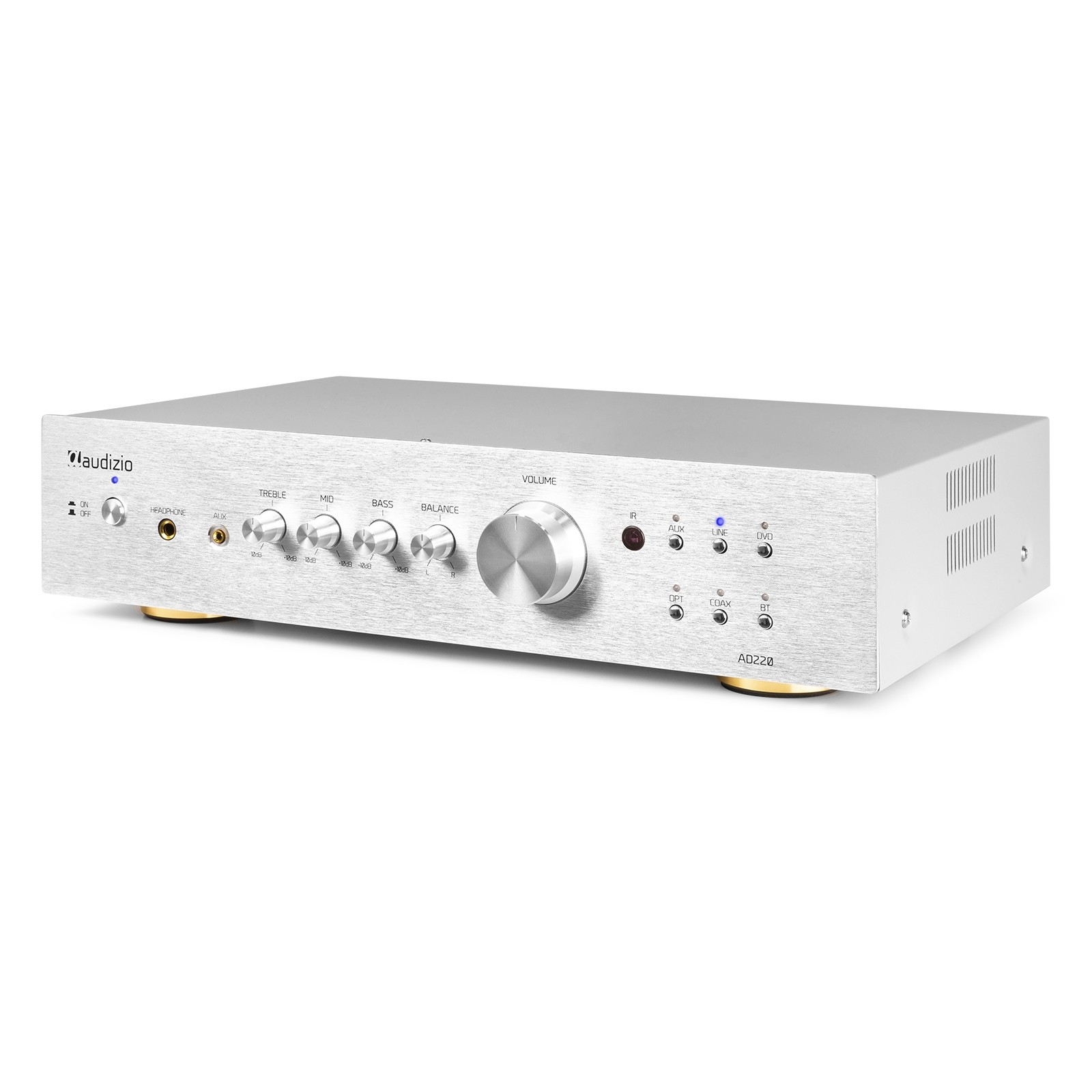 Un amplificador de audio plateado con perillas para volumen, agudos y graves. Tiene botones e indicador de encendido.