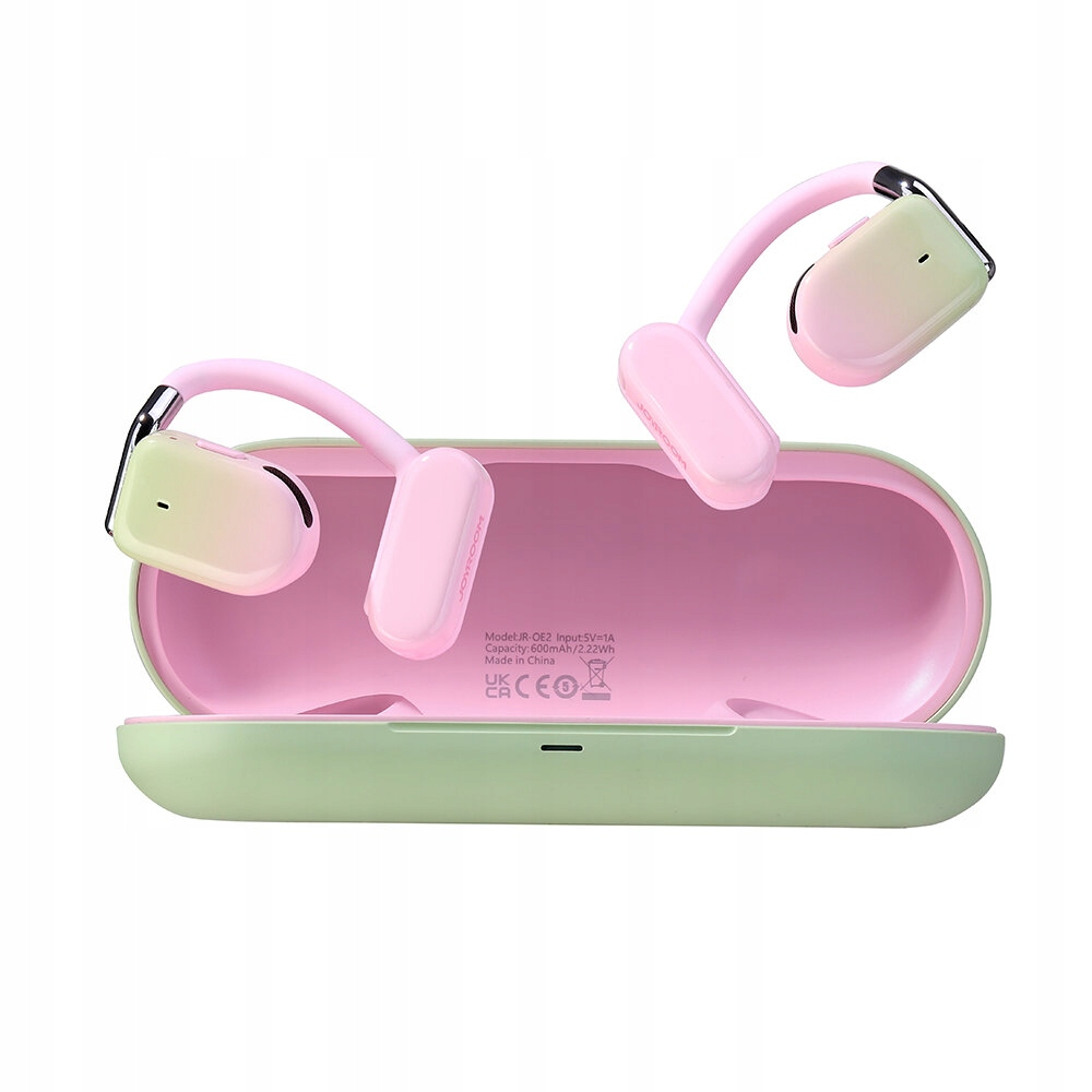 Auricolari wireless rosa e bianchi in una custodia verde e rosa. Gli auricolari sono posizionati attorno alla custodia aperta. La custodia è aperta.