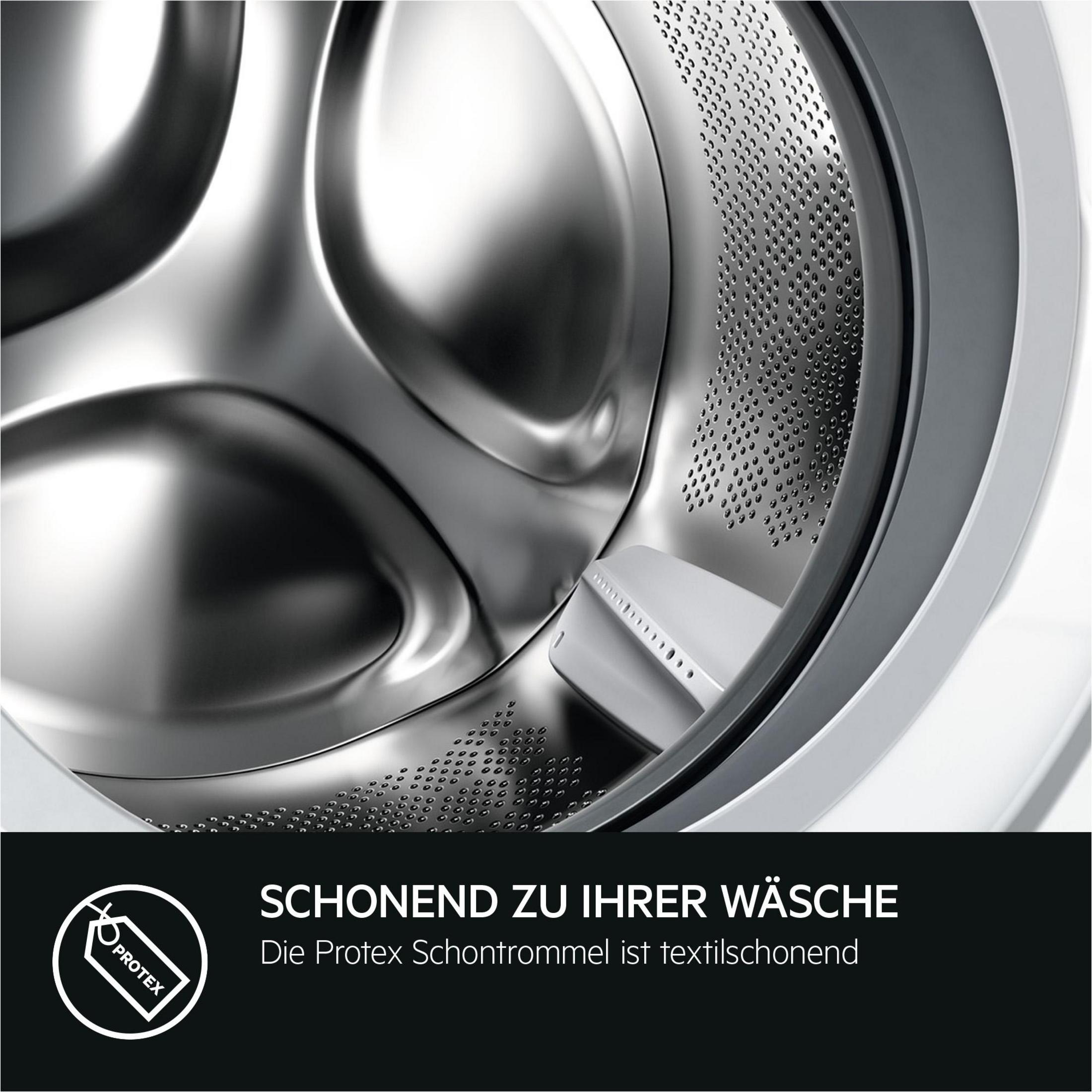Innenraum einer Waschmaschinentrommel aus Edelstahl. Ein weißes Kunststoffteil ist sichtbar. Der Text lautet: 'Schonend zu Ihrer Wäsche'.