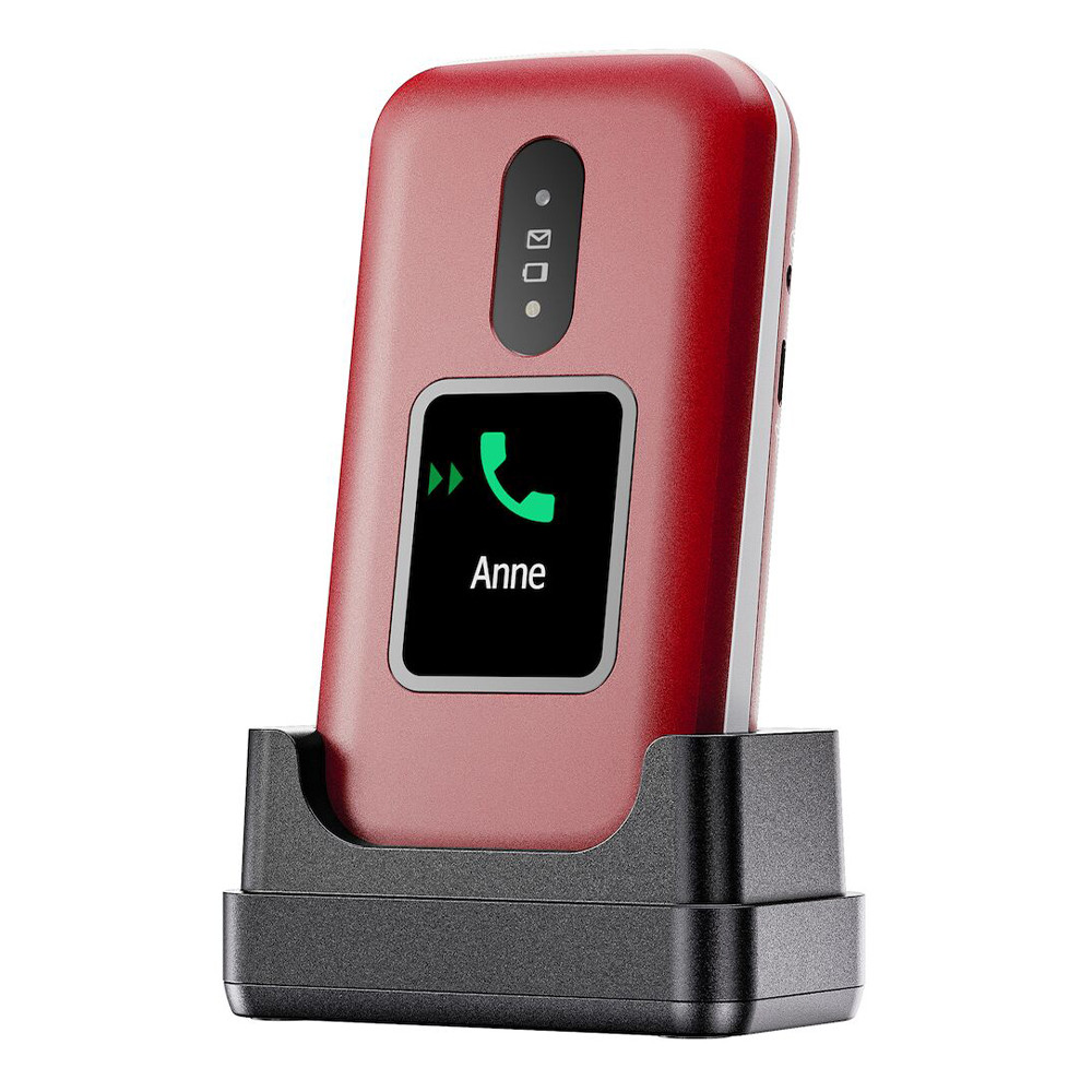 Czerwony telefon z klapką w czarnej stacji ładującej. Ekran wyświetla zieloną ikonę telefonu i imię 'Anne'.