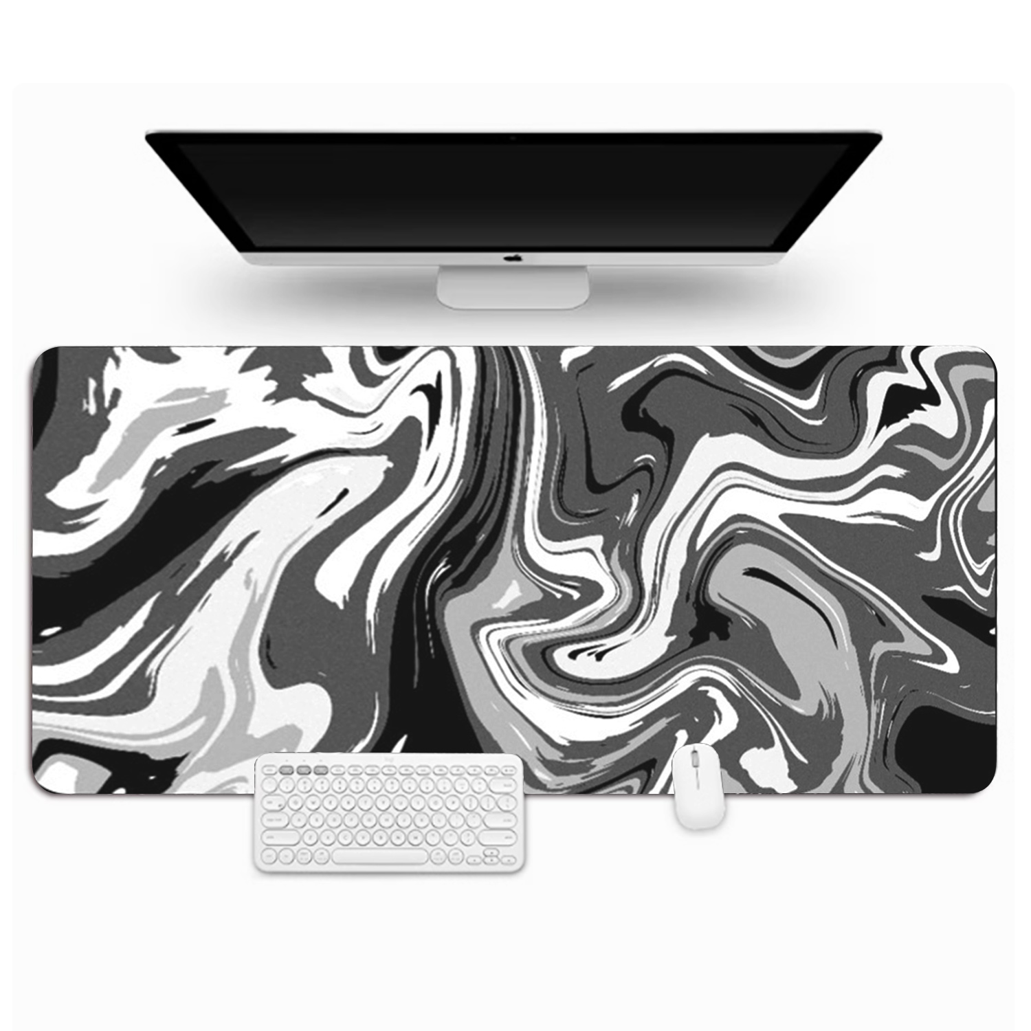 Une configuration informatique avec un écran, une souris et un clavier sur un tapis de souris à motif marbré.